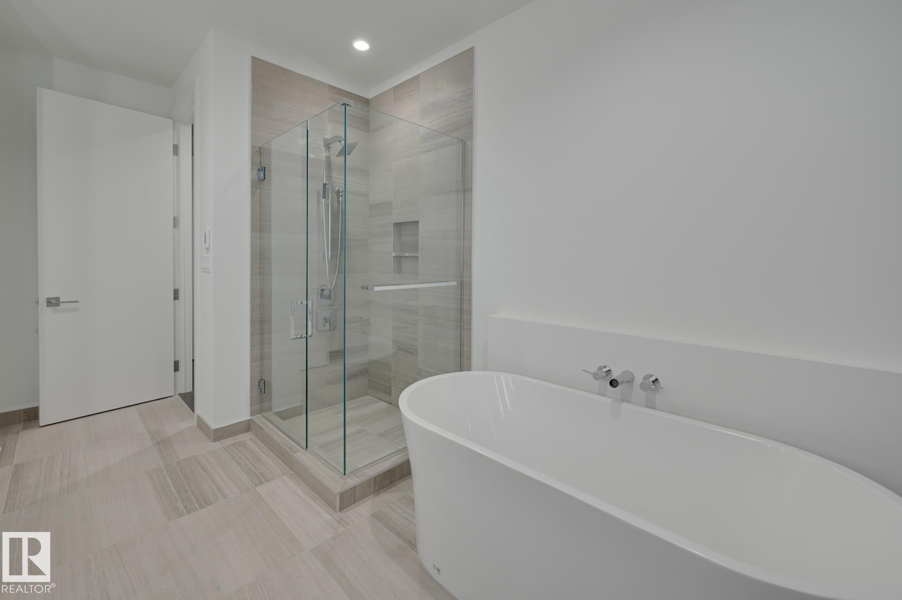 Full bath with a soaking tub, a shower stall, and recessed lighting - 2303 10360 102 Street, Edmonton, AB - Indoor Photo Showing Bathroom