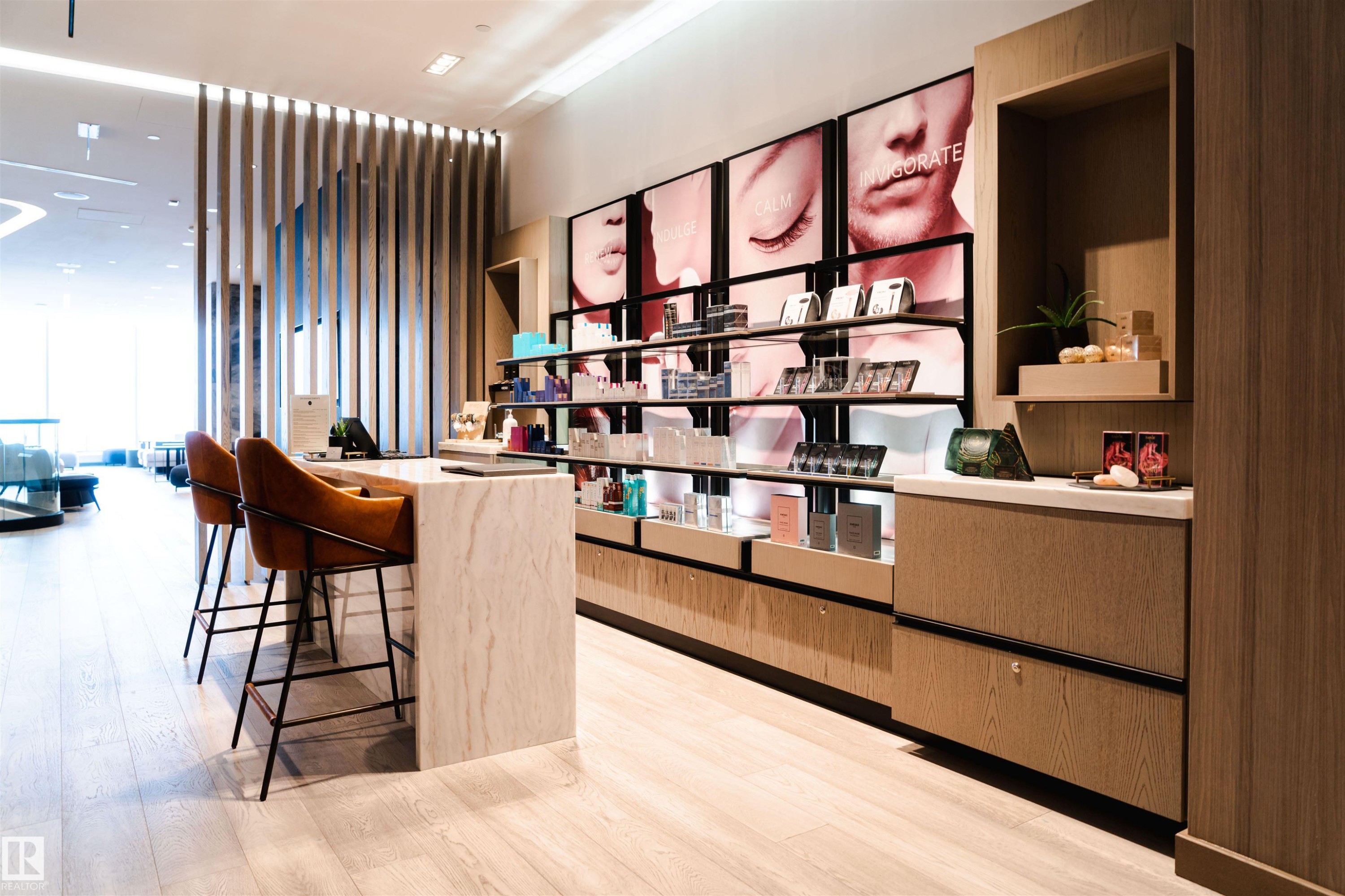 Bar featuring a wall of windows, open shelves, light stone countertops, modern cabinets, and light brown cabinets - 2303 10360 102 Street, Edmonton, AB - Indoor