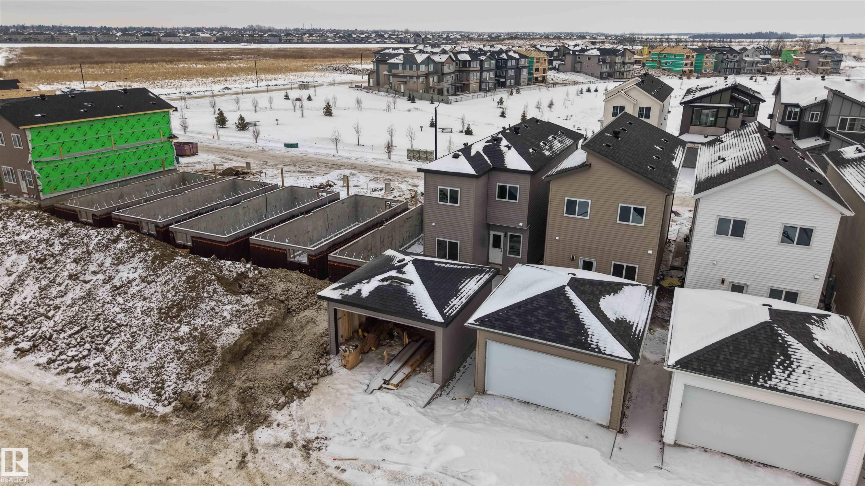 Snowy aerial view with a residential view - 430 Crystal Creek Link, Leduc, AB - Outdoor