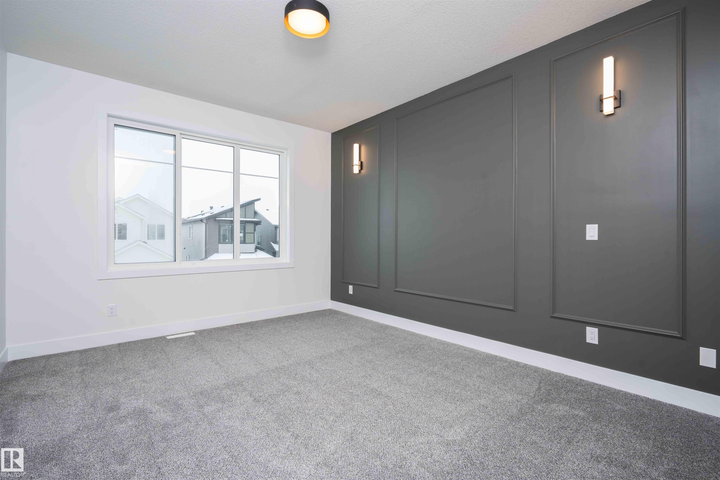 Empty room featuring carpet floors and a decorative wall - 430 Crystal Creek Link, Leduc, AB - Indoor Photo Showing Other Room