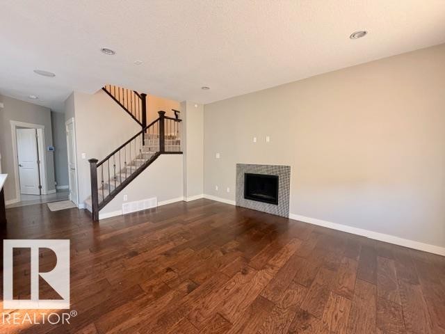 5025 53 Avenue, Calmar, AB - Indoor Photo Showing Other Room With Fireplace
