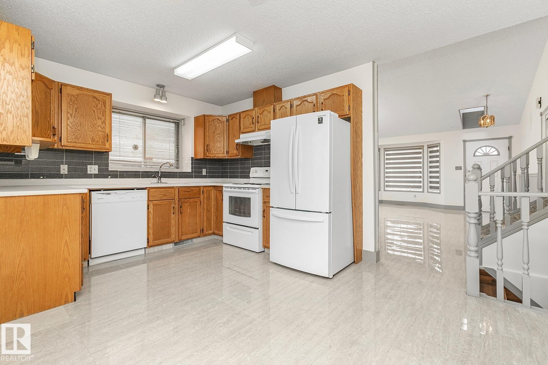 Edmonton, AB - Indoor Photo Showing Kitchen With Double Sink