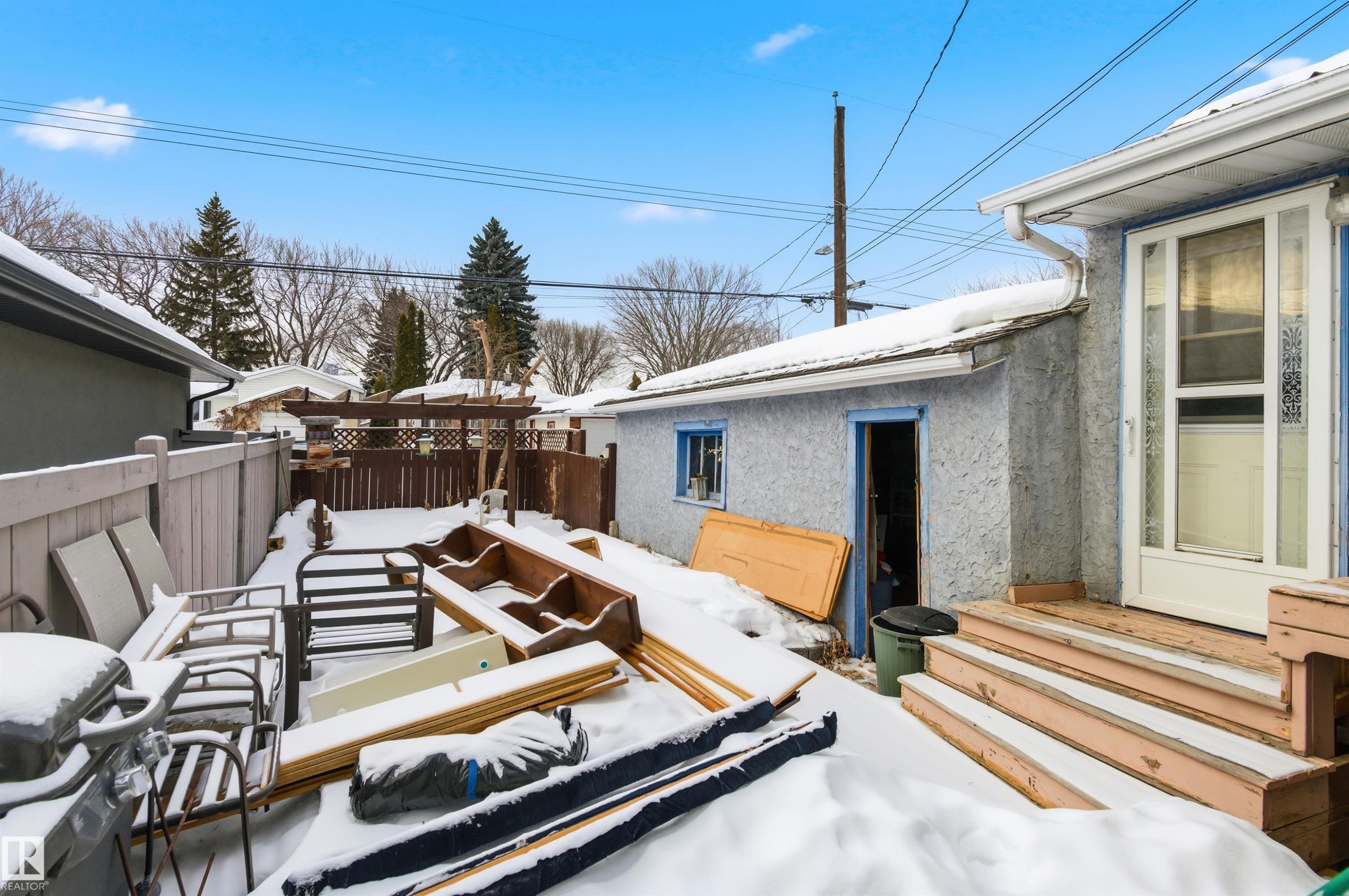 Wooden deck featuring a grill and entry steps - 10332 82 Street, Edmonton, AB - Outdoor With Exterior