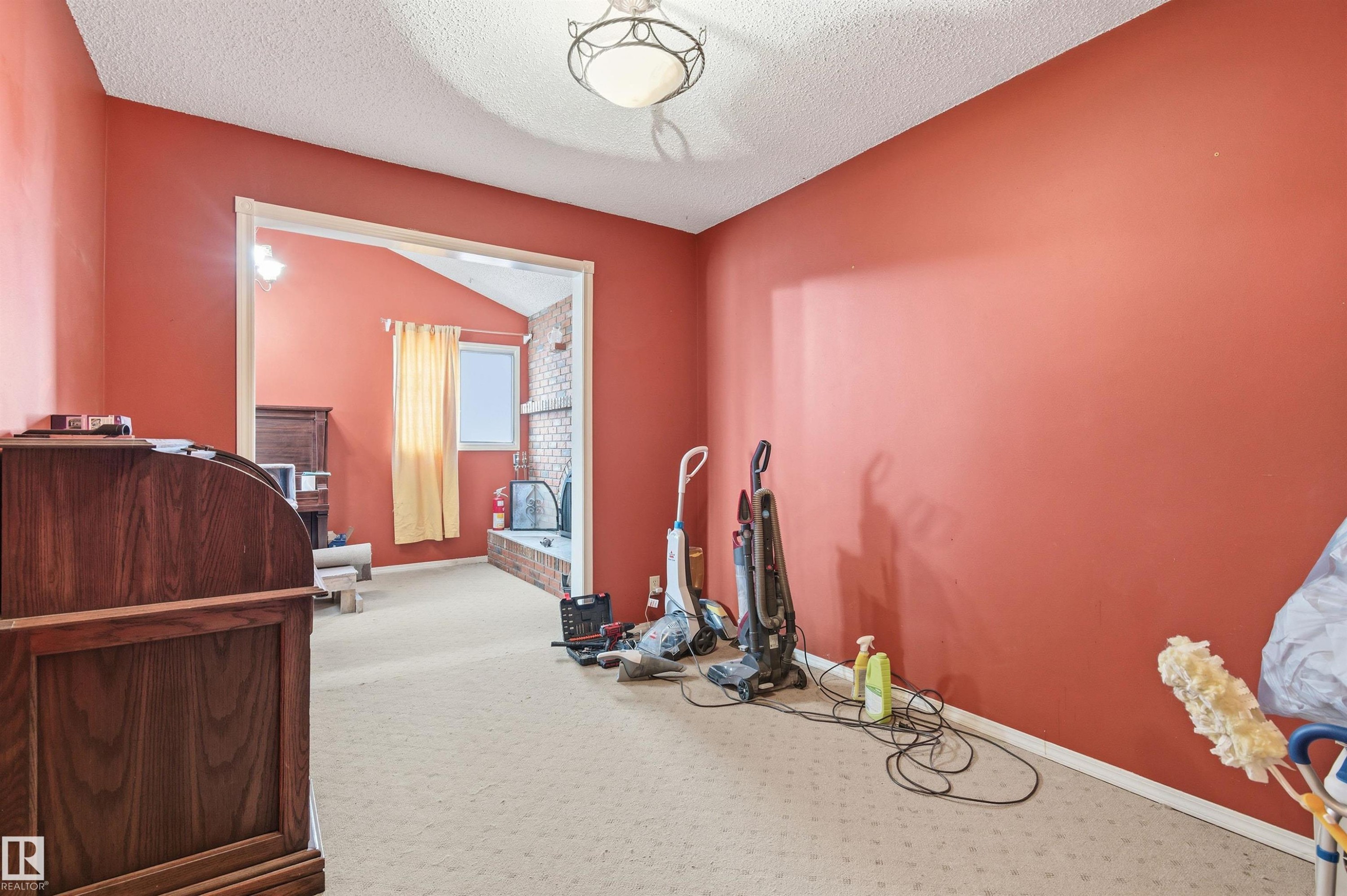 Carpet flooring and a textured ceiling - 10332 82 Street, Edmonton, AB - Indoor