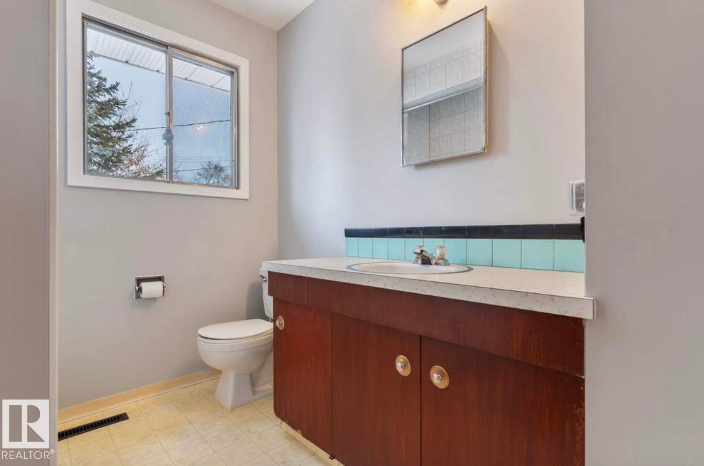 Bathroom with vanity and light flooring - 3810 110 Avenue, Edmonton, AB - Indoor Photo Showing Bathroom