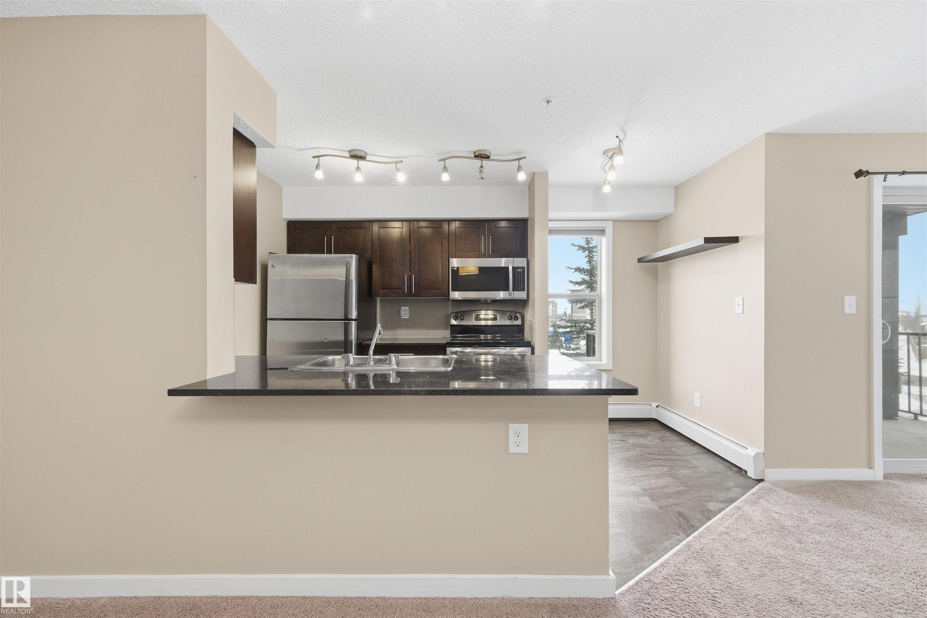 221 1070 Mcconachie Boulevard, Edmonton, AB - Indoor Photo Showing Kitchen With Double Sink