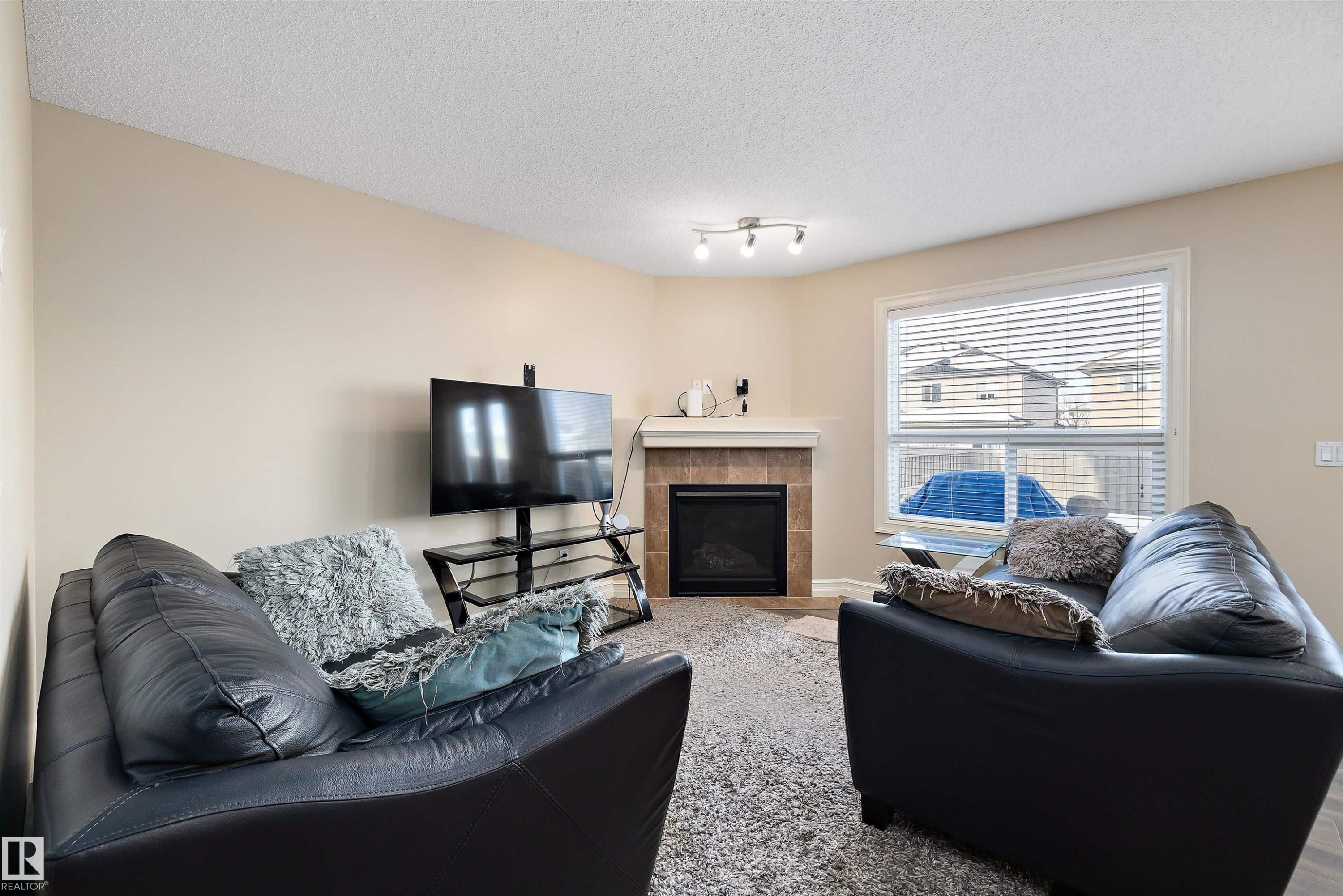 2407 Casselman Crescent, Edmonton, AB - Indoor Photo Showing Living Room With Fireplace