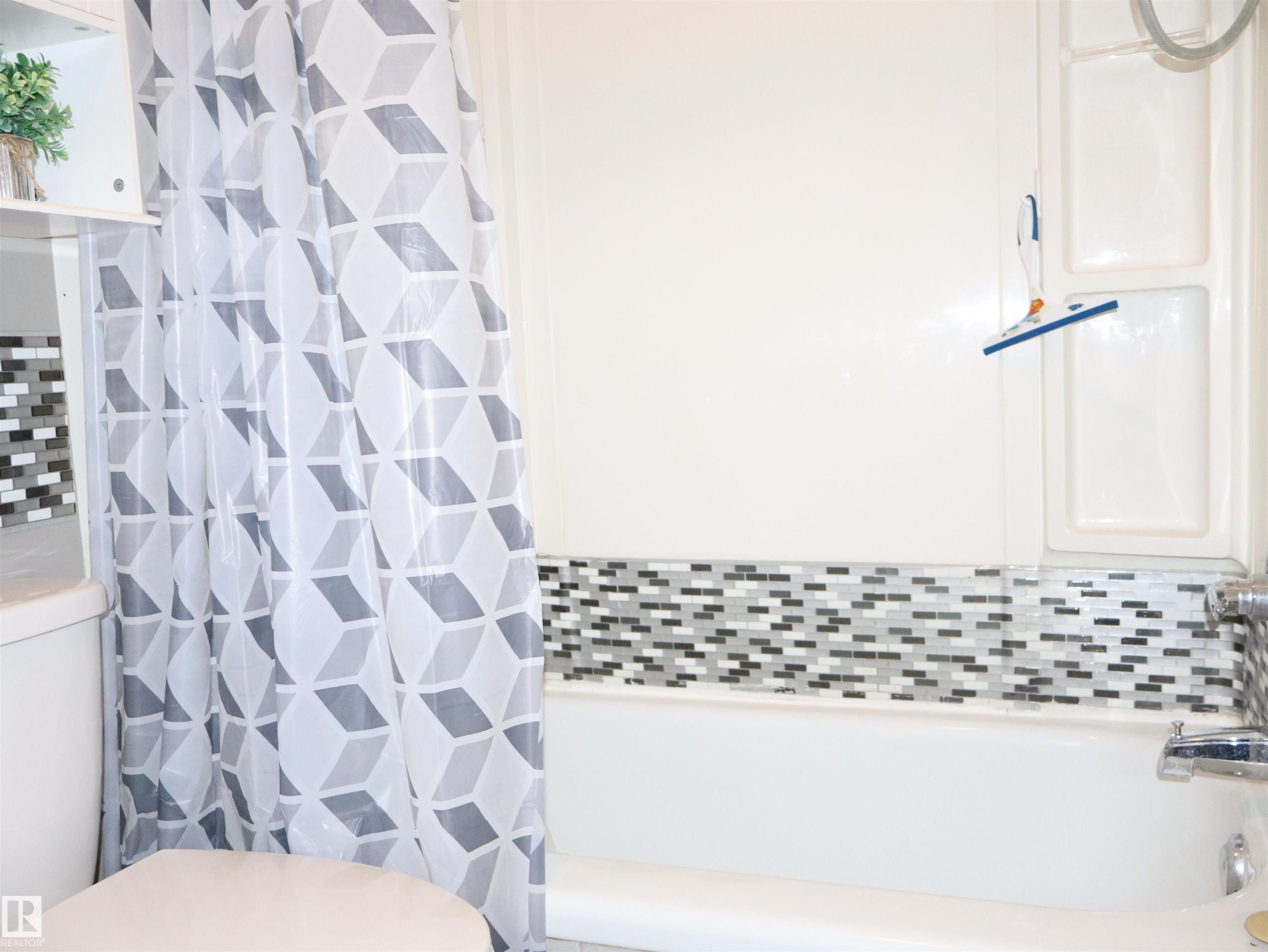 Bathroom featuring toilet - 4511 53 Ave, Barrhead, AB - Indoor Photo Showing Bathroom