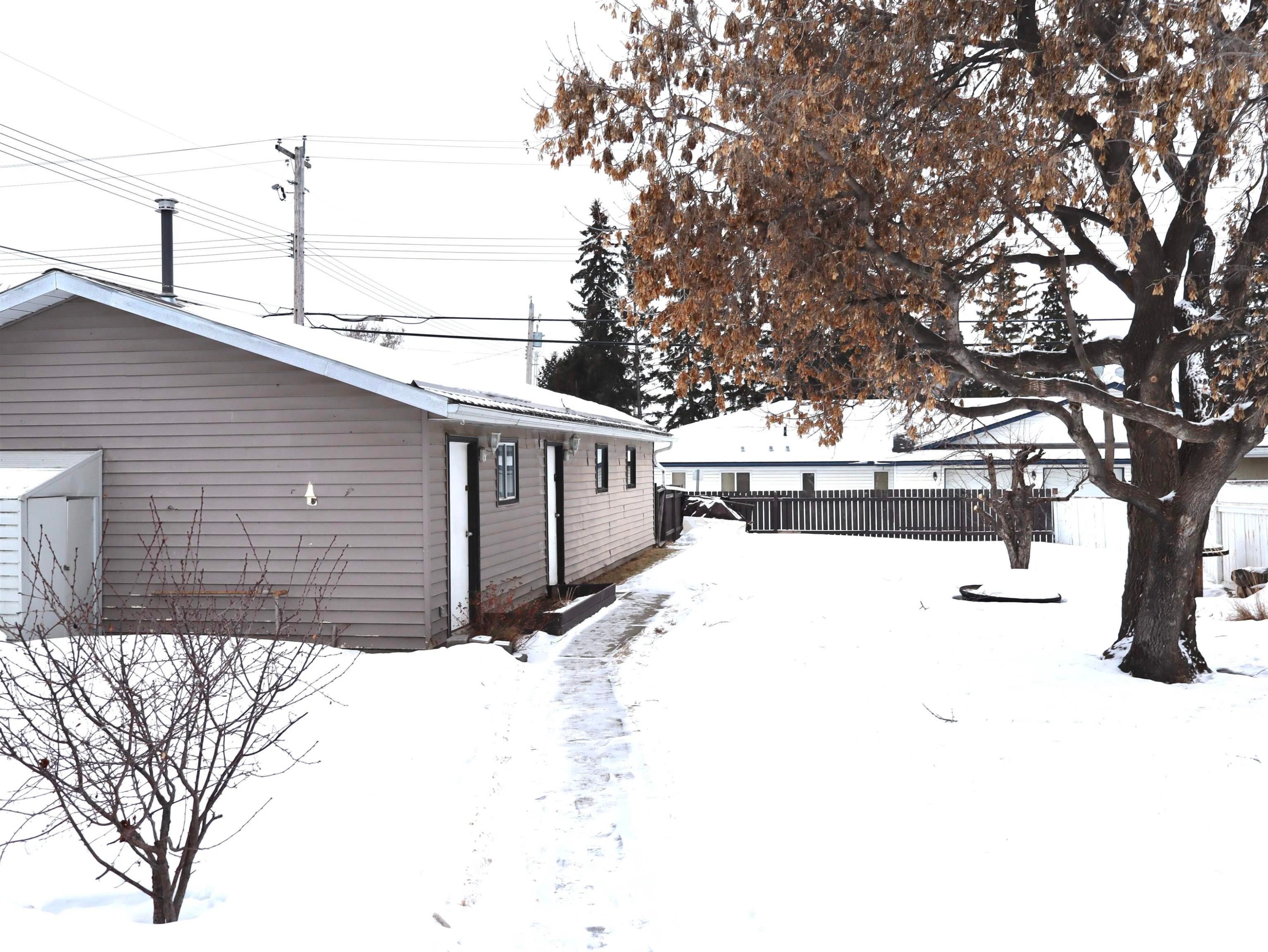 View of yard layered in snow - 4511 53 Ave, Barrhead, AB - Outdoor