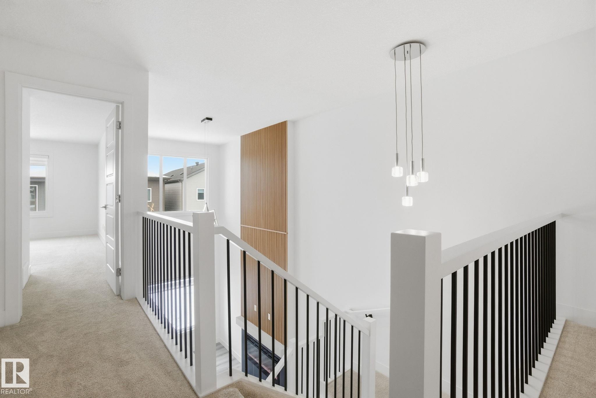 Hallway featuring light colored carpet and an upstairs landing - 2532 210 Street, Edmonton, AB - Indoor Photo Showing Other Room