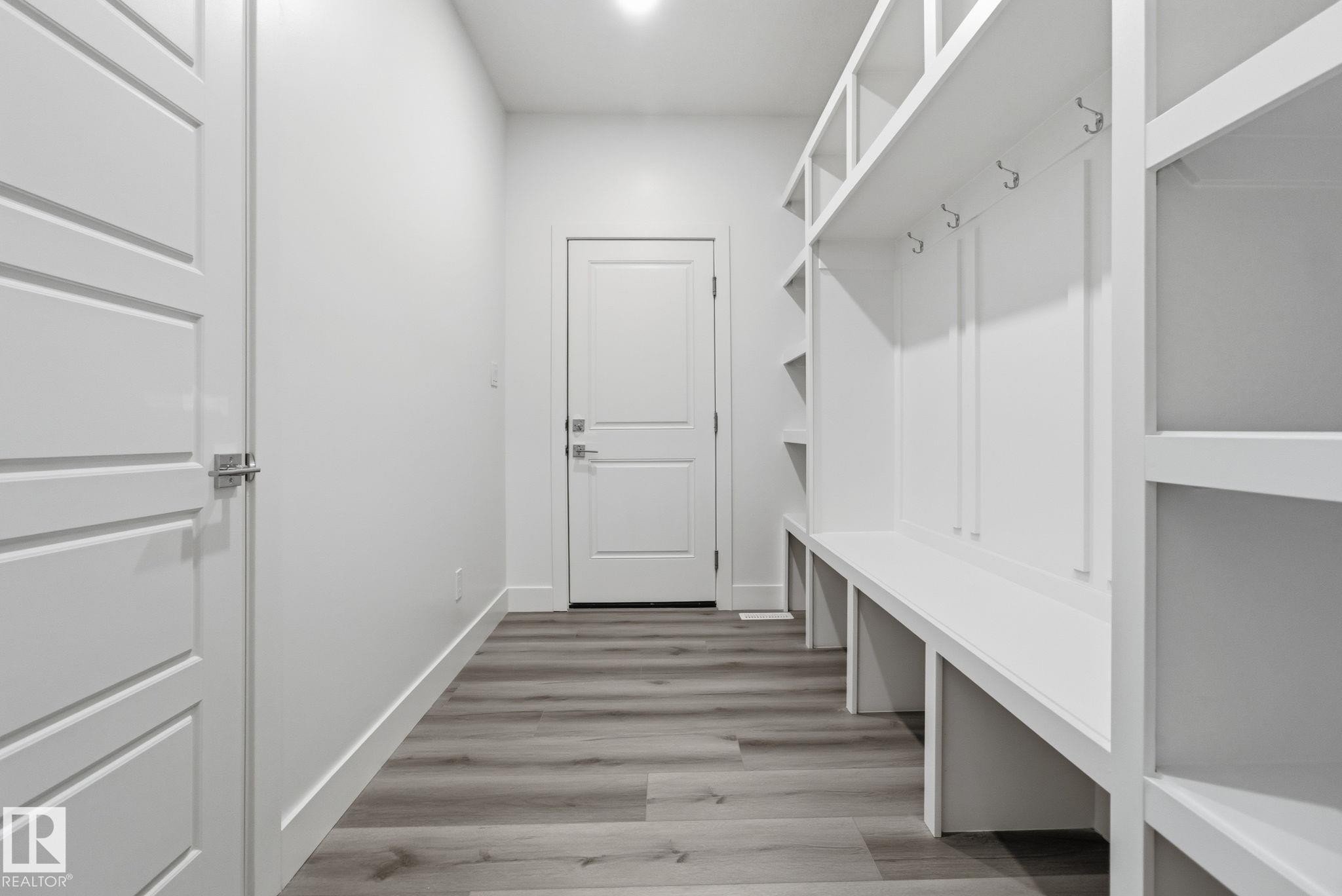 Mudroom featuring light wood-type flooring and baseboards - 2532 210 Street, Edmonton, AB - Indoor Photo Showing Other Room