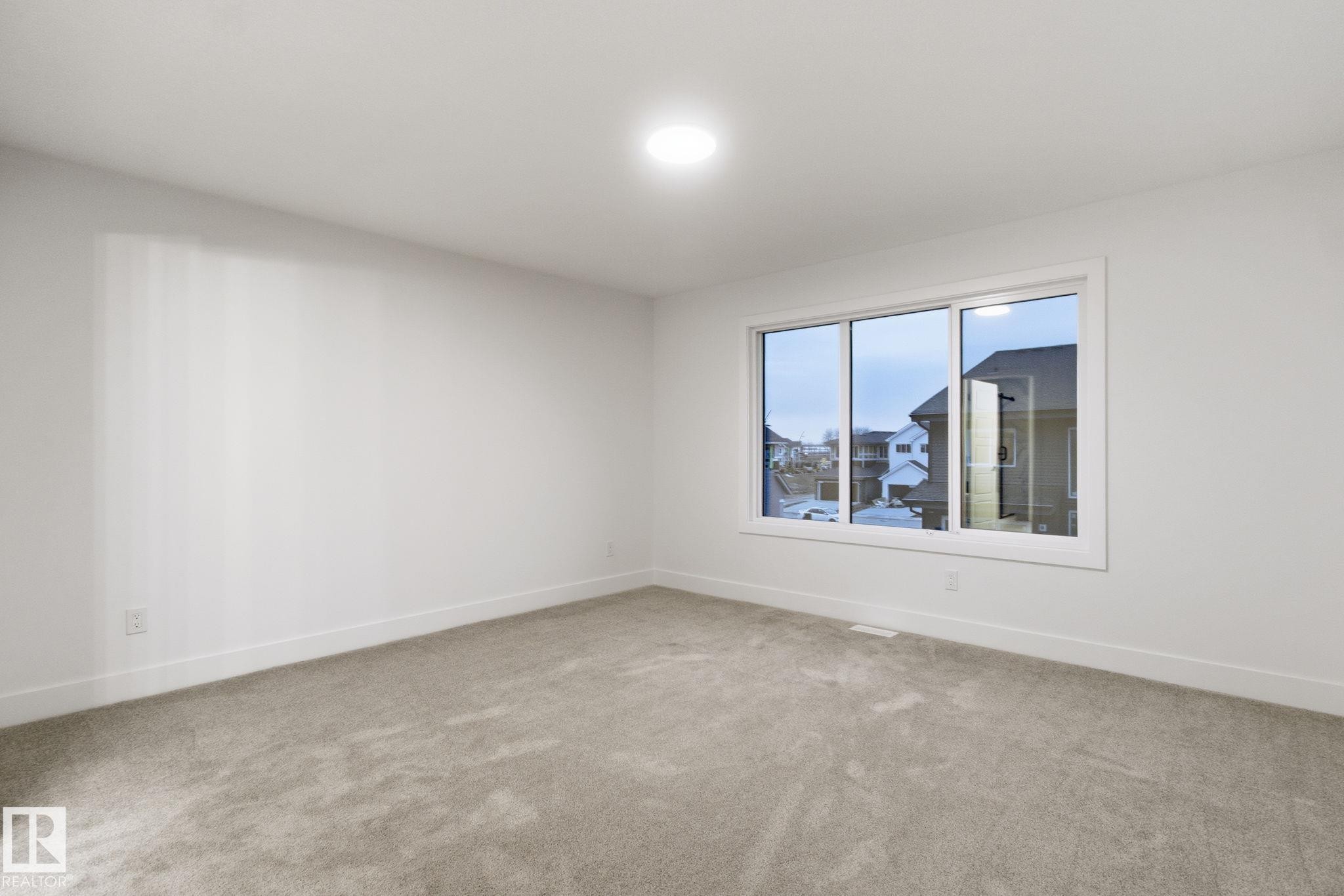 Unfurnished room with light colored carpet and baseboards - 2532 210 Street, Edmonton, AB - Indoor Photo Showing Other Room