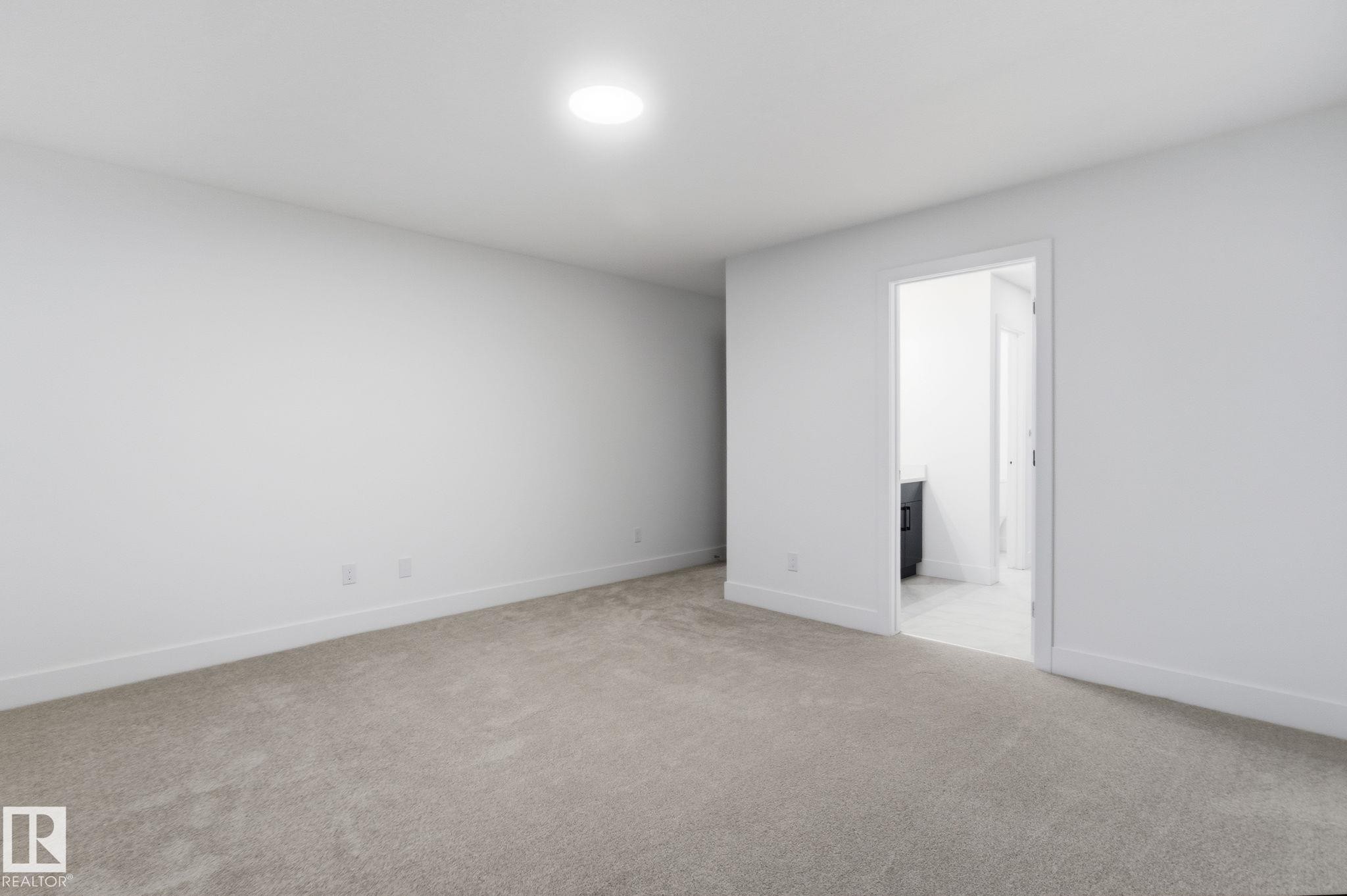 Empty room featuring light colored carpet and baseboards - 2532 210 Street, Edmonton, AB - Indoor Photo Showing Other Room