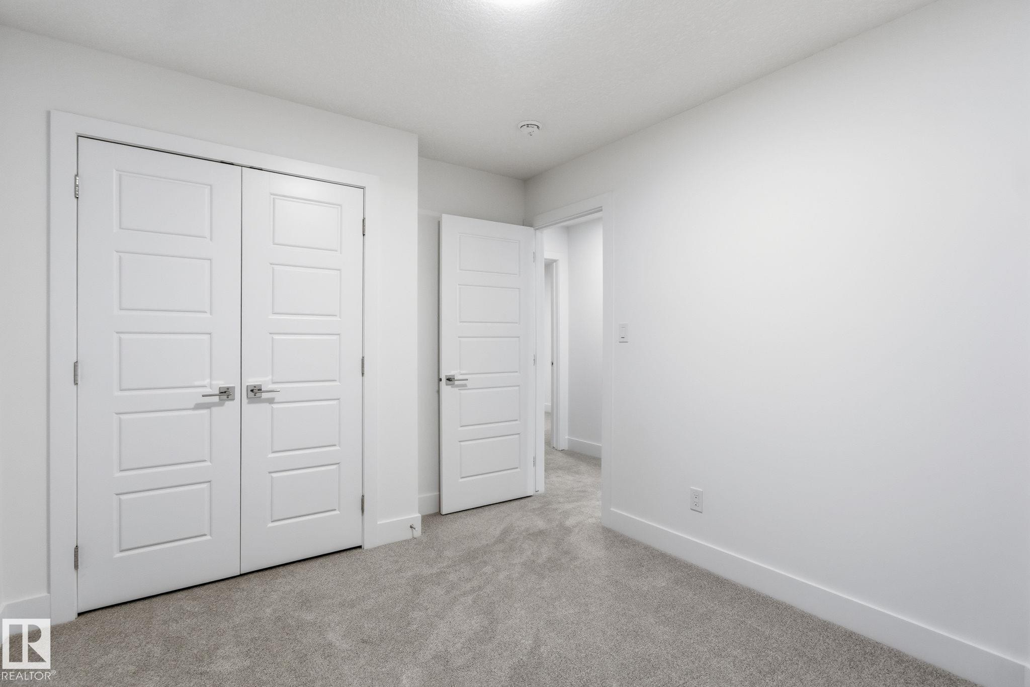 Unfurnished bedroom with carpet flooring and a closet - 2532 210 Street, Edmonton, AB - Indoor Photo Showing Other Room