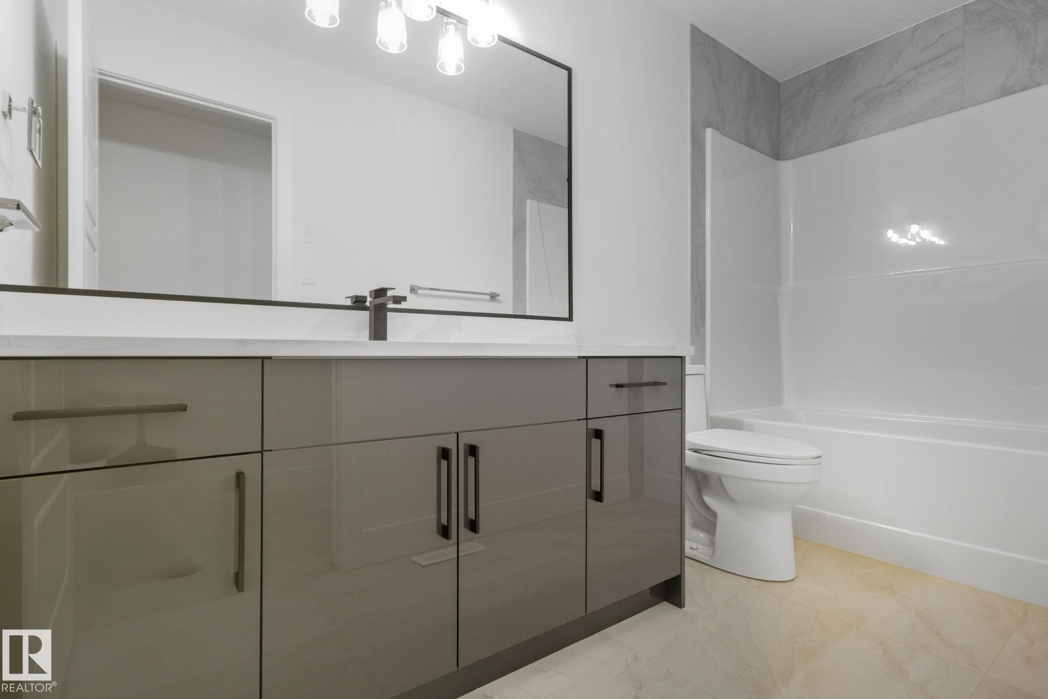 Bathroom with vanity and shower / bathtub combination - 2532 210 Street, Edmonton, AB - Indoor Photo Showing Bathroom