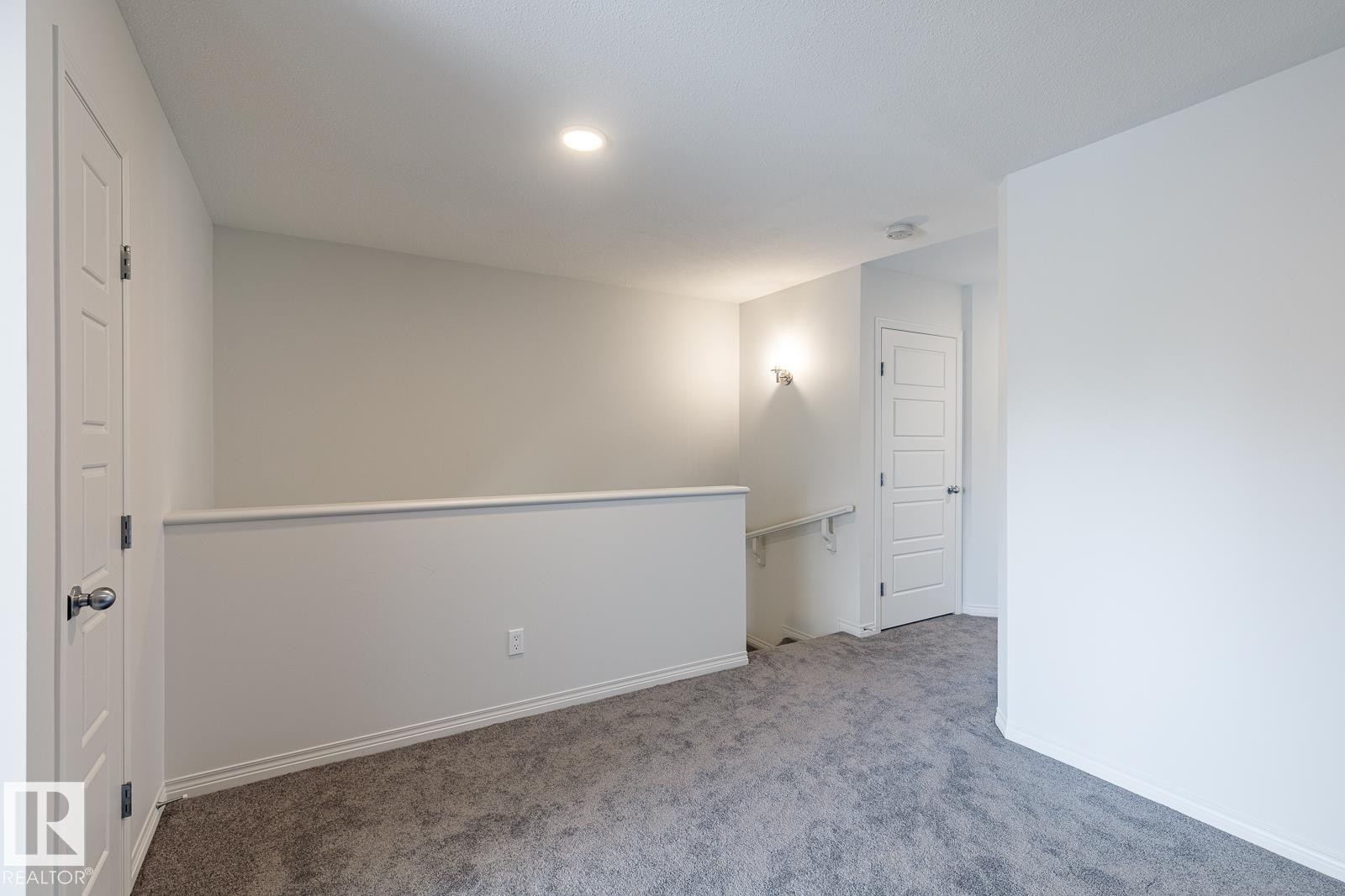 Unfurnished room featuring carpet and baseboards - 3617 Triomphe Boulevard, Beaumont, AB - Indoor Photo Showing Other Room