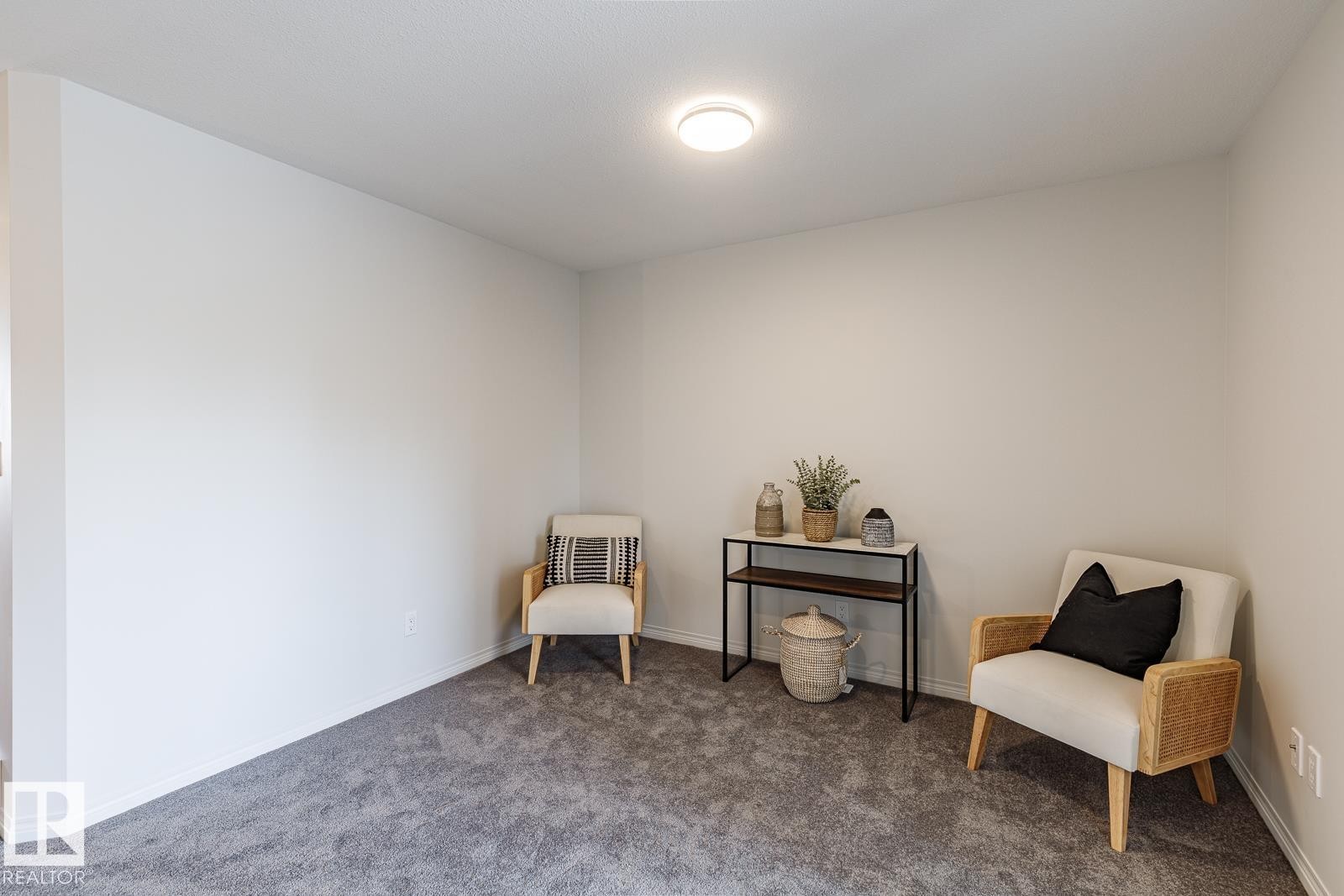 Sitting room with carpet and baseboards - 3617 Triomphe Boulevard, Beaumont, AB - Indoor