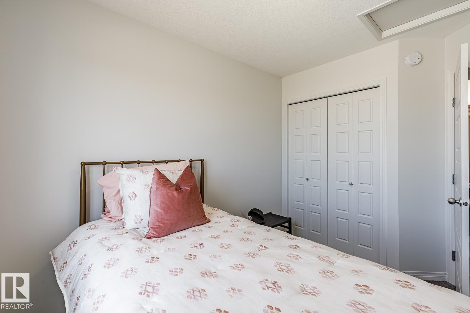 Bedroom with a closet - 3617 Triomphe Boulevard, Beaumont, AB - Indoor Photo Showing Bedroom