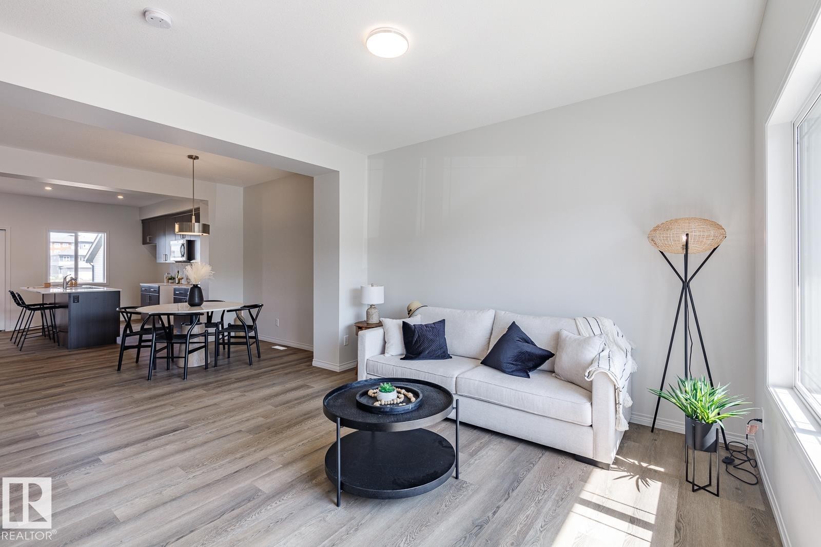 Living area with light wood-type flooring - 3617 Triomphe Boulevard, Beaumont, AB - Indoor Photo Showing Living Room