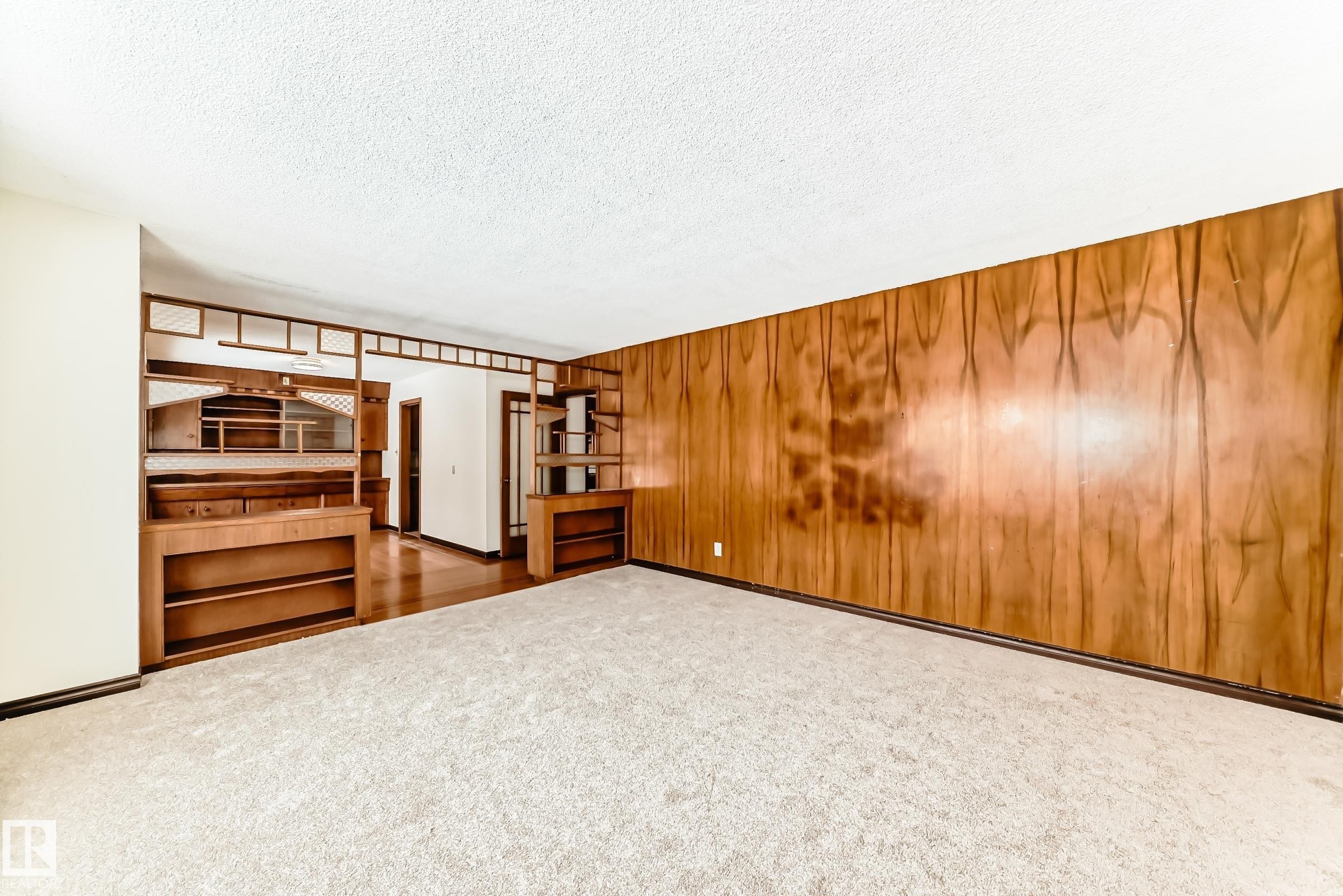 Unfurnished bedroom featuring carpet flooring and a textured ceiling - 12028 87 Street, Edmonton, AB - Indoor Photo Showing Other Room