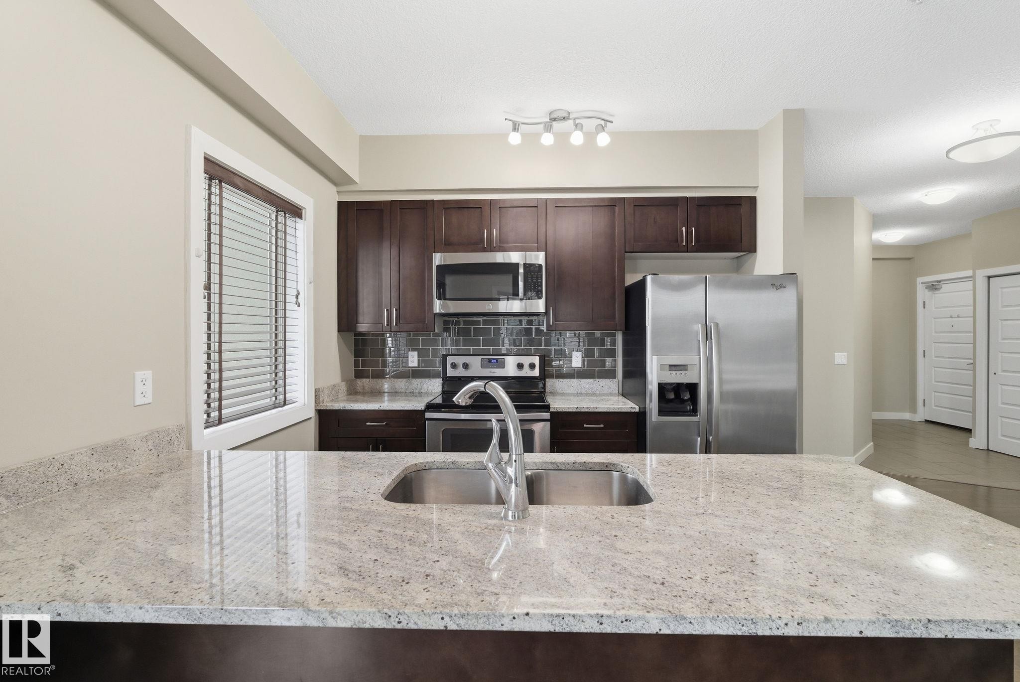 214 1238 Windermere Way, Edmonton, AB - Indoor Photo Showing Kitchen With Stainless Steel Kitchen With Double Sink With Upgraded Kitchen
