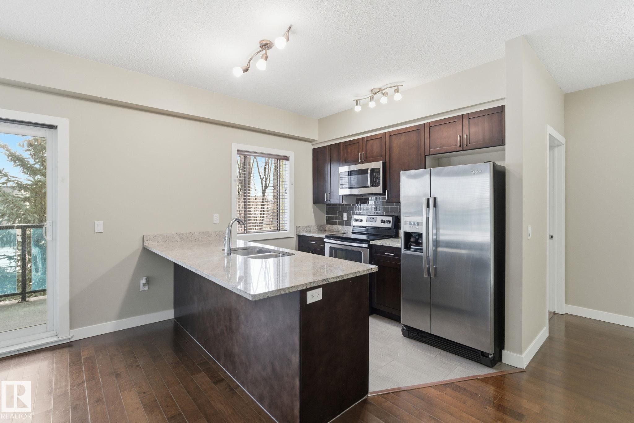 214 1238 Windermere Way, Edmonton, AB - Indoor Photo Showing Kitchen With Stainless Steel Kitchen