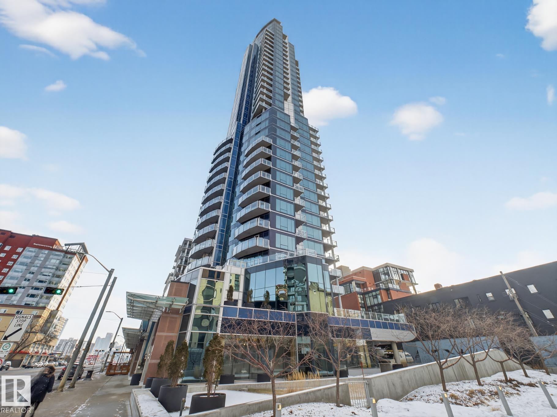 View of snow covered building - #902 11969 Jasper Av Nw, Edmonton, AB - Outdoor With Facade
