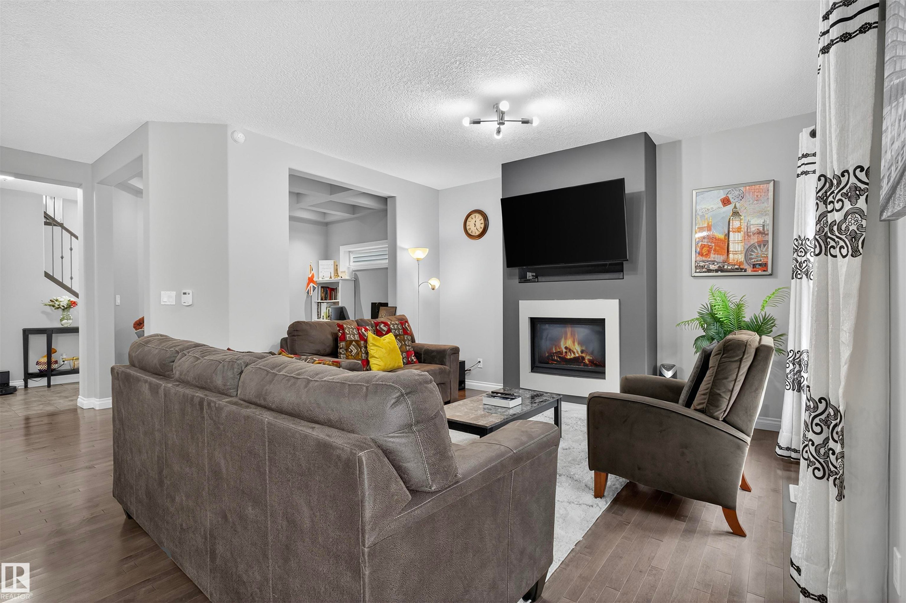 618 Adams Way Sw, Edmonton, AB - Indoor Photo Showing Living Room With Fireplace