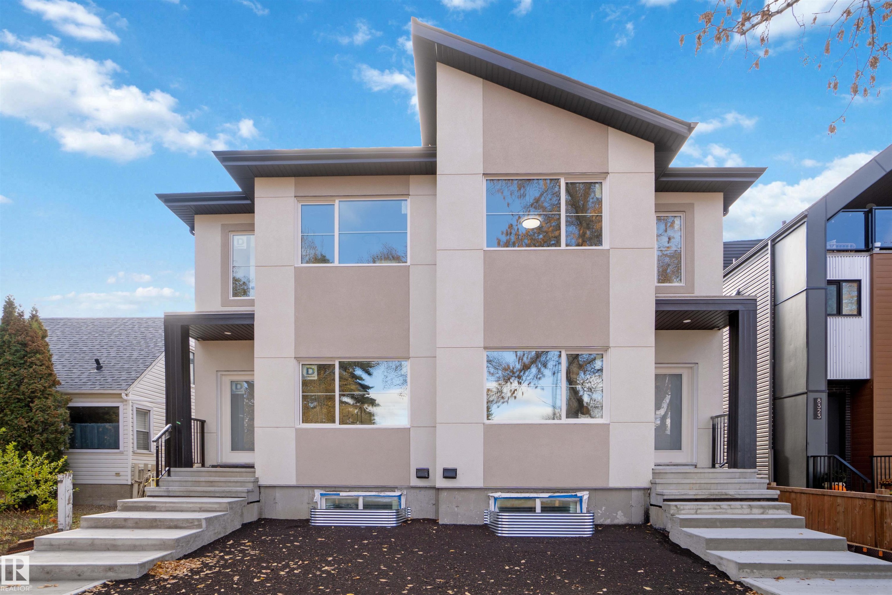 Modern home with stucco siding - 8319 81Ave, Edmonton, AB - Outdoor With Facade