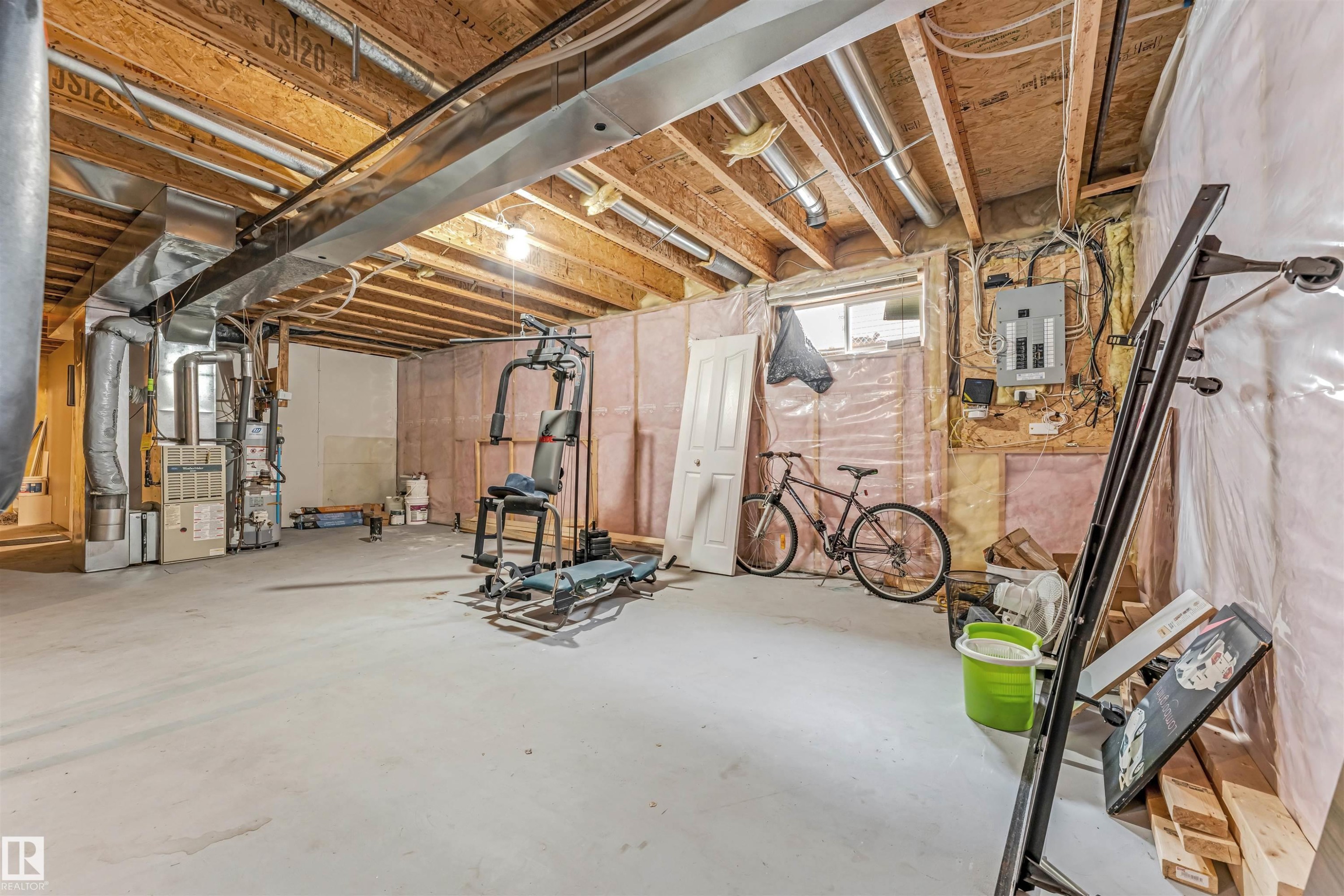Basement with electric panel, heating unit, and water heater - 6741 162A Avenue, Edmonton, AB - Indoor Photo Showing Basement