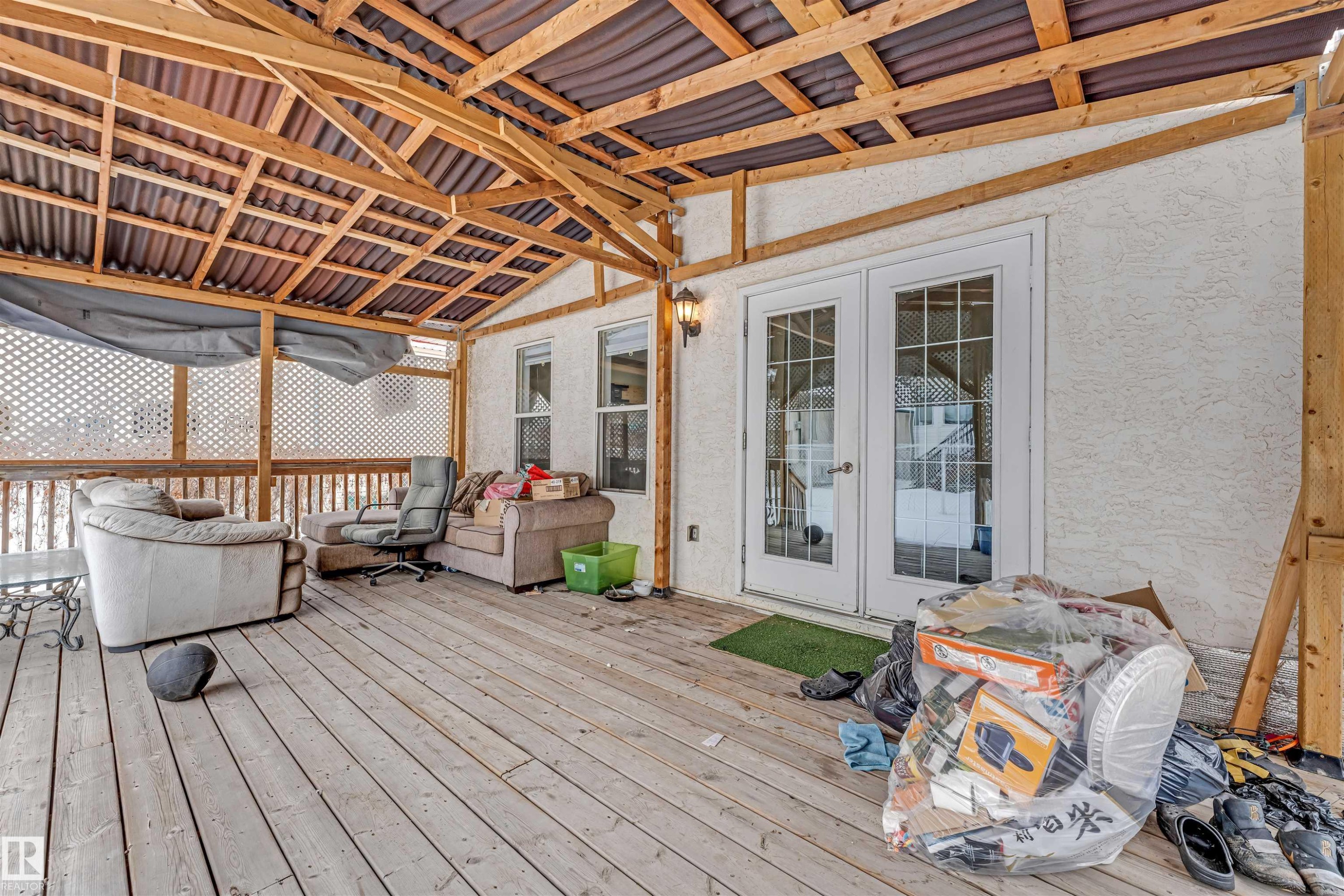 Wooden deck featuring french doors - 6741 162A Avenue, Edmonton, AB - Outdoor With Deck Patio Veranda With Exterior