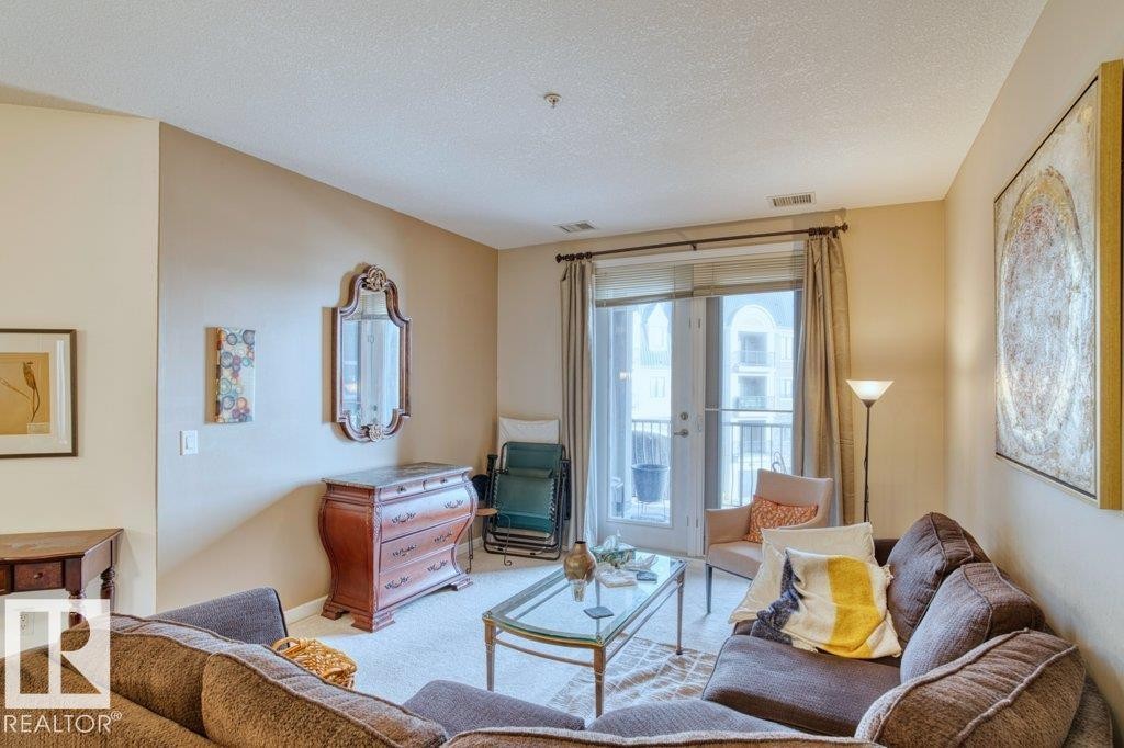 319 6083 Maynard Way, Edmonton, AB - Indoor Photo Showing Living Room