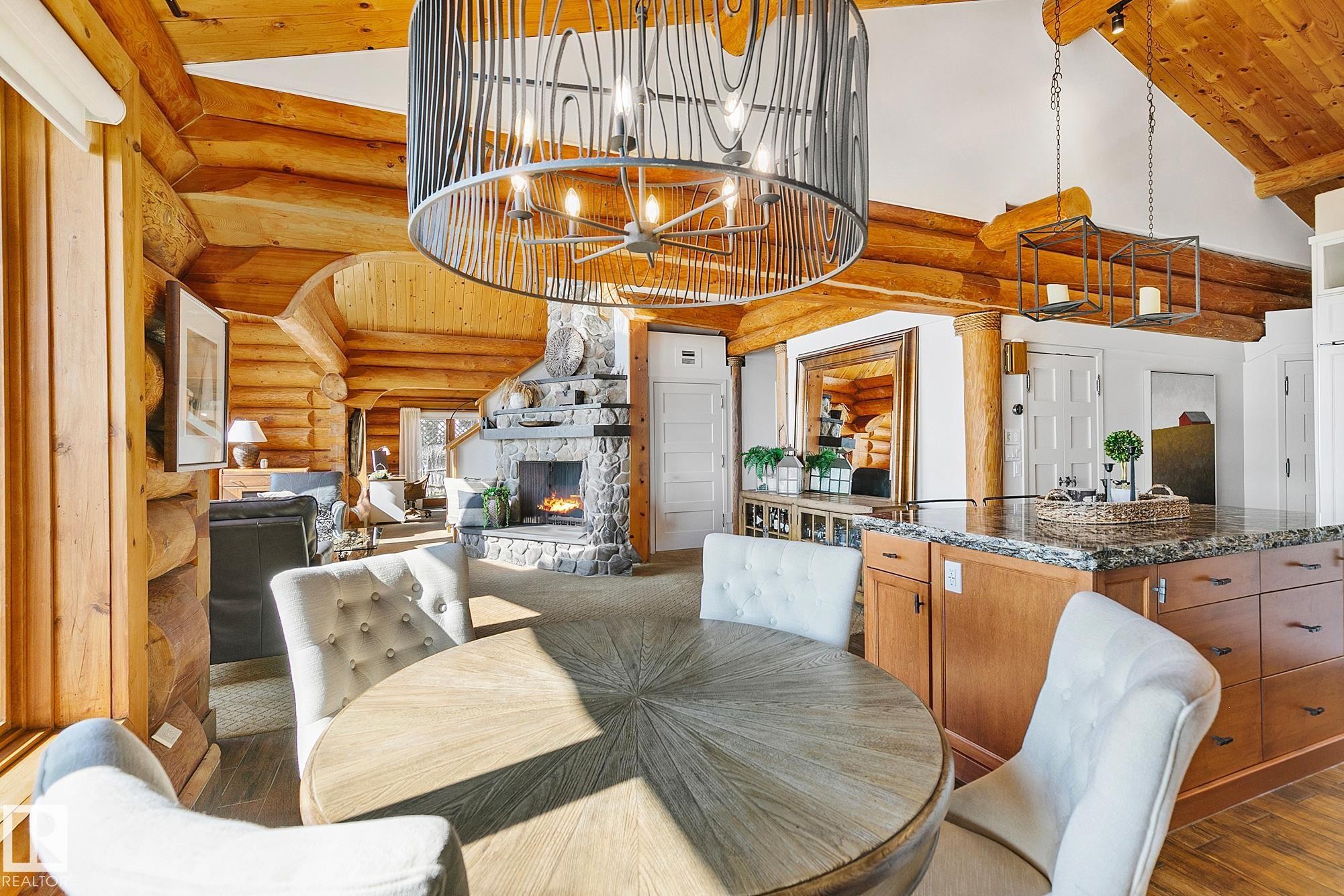 #1 Martin Road, Rural Lac Ste. Anne County, AB - Indoor Photo Showing Dining Room With Fireplace