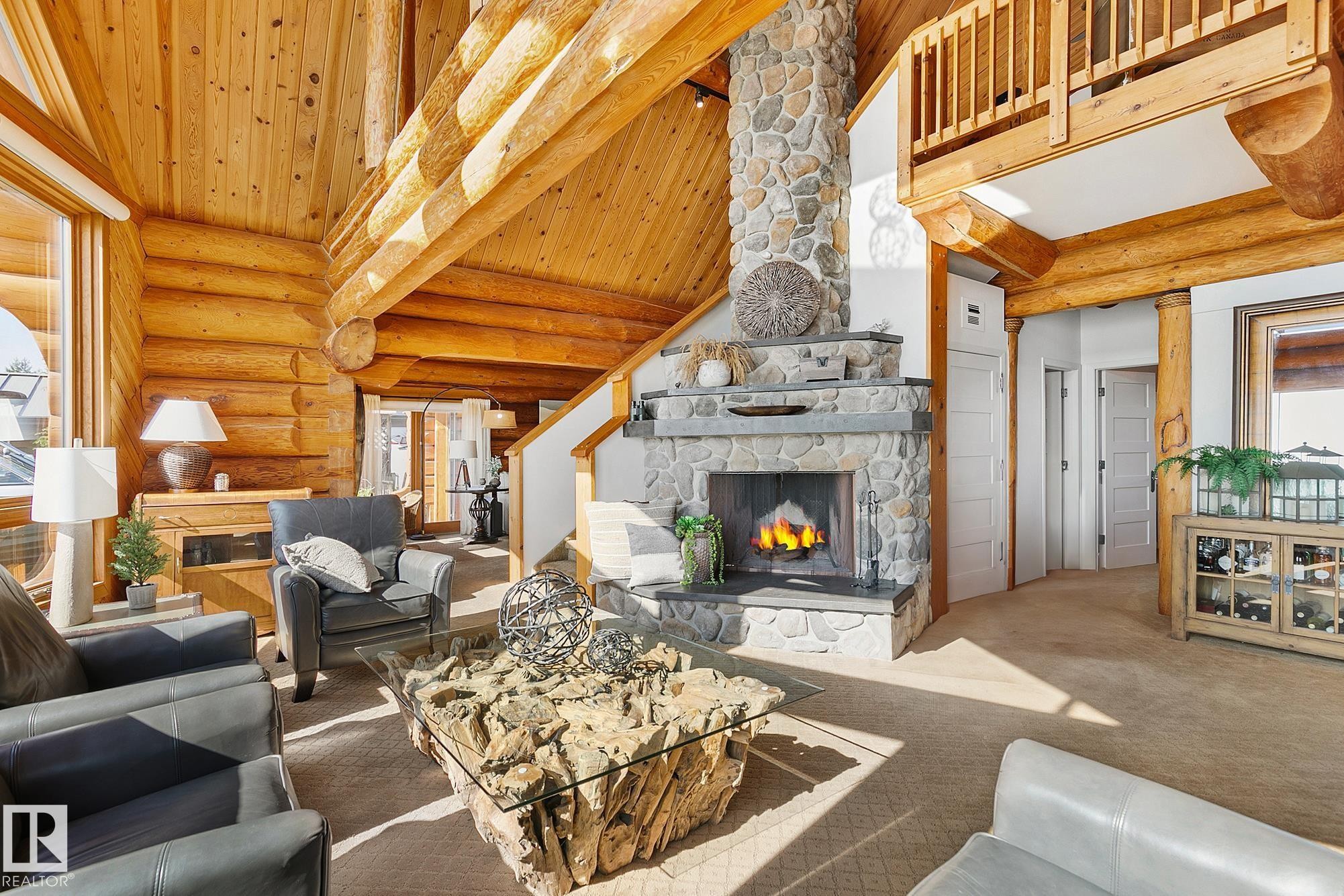 #1 Martin Road, Rural Lac Ste. Anne County, AB - Indoor Photo Showing Living Room With Fireplace
