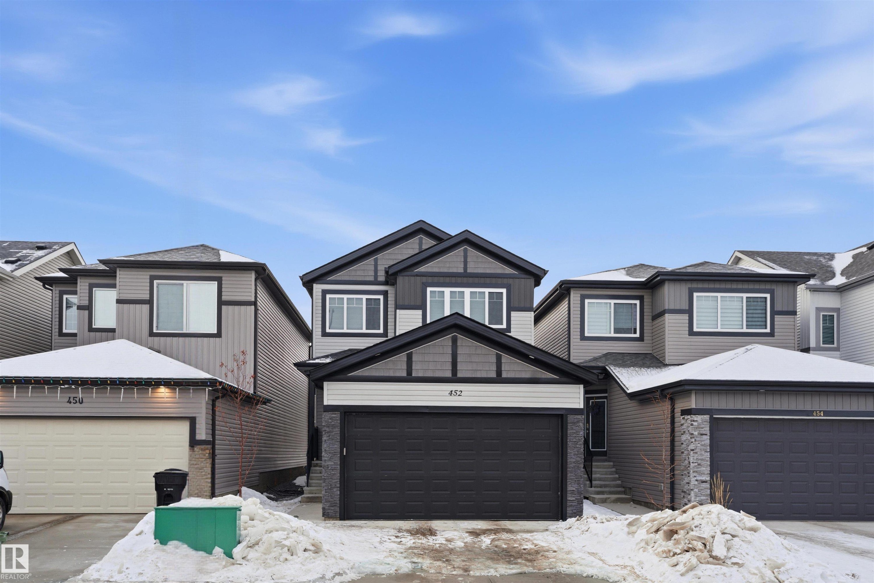 View of front of house featuring brick siding - 452 Roberts Crescent, Leduc, AB - Outdoor With Facade