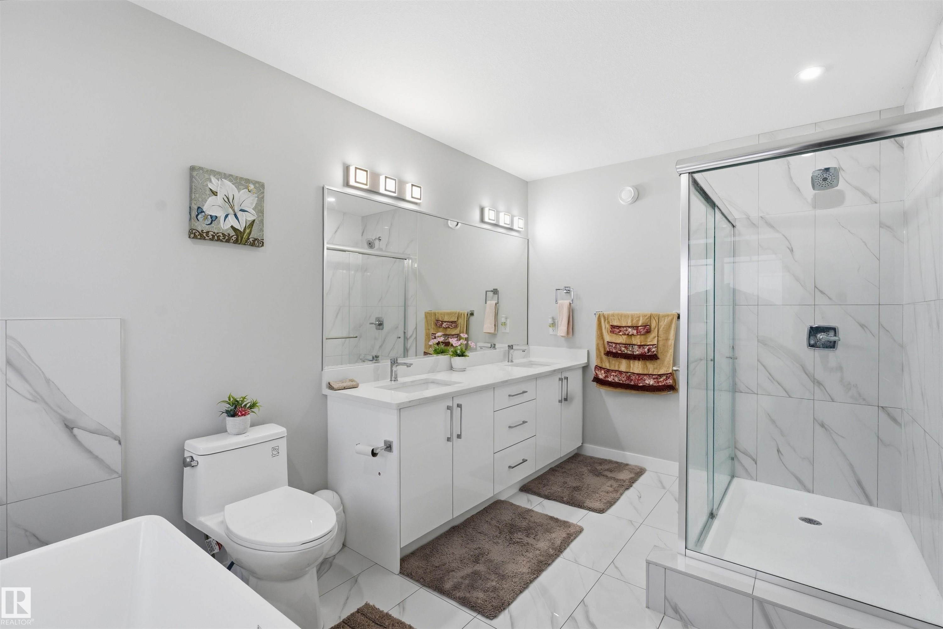 Bathroom featuring double vanity and a marble finish shower - 452 Roberts Crescent, Leduc, AB - Indoor Photo Showing Bathroom