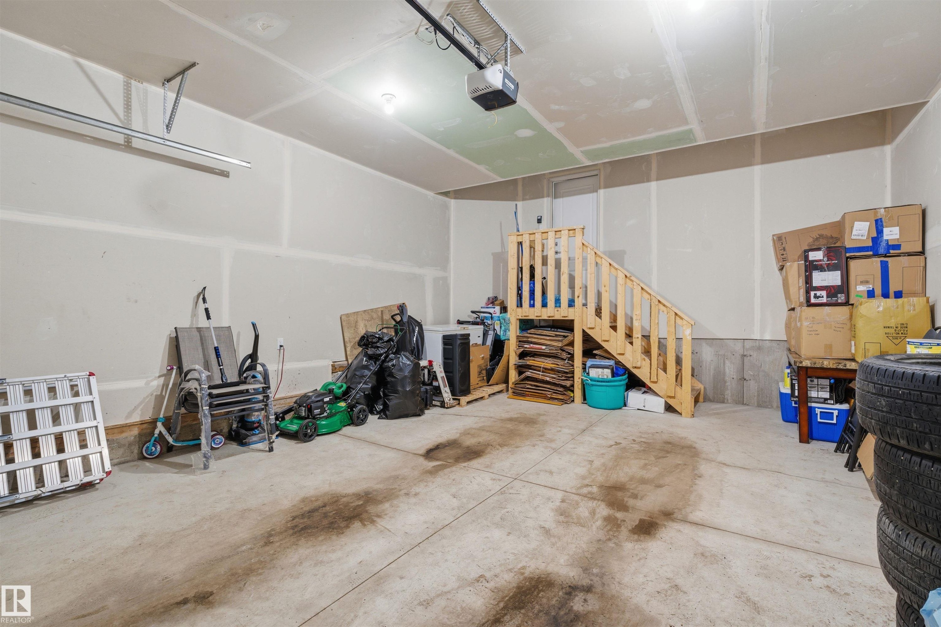 Garage featuring a garage door opener - 452 Roberts Crescent, Leduc, AB - Indoor Photo Showing Garage