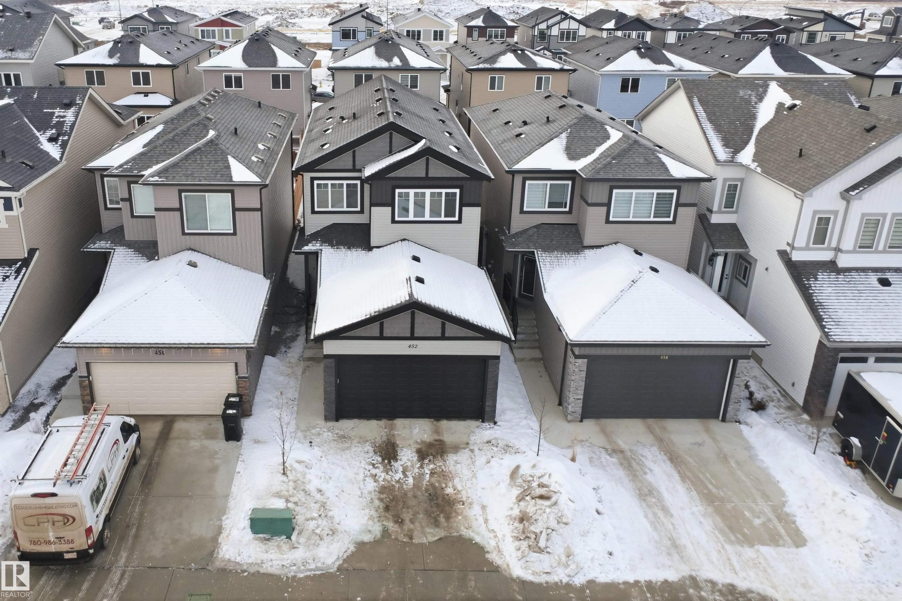 Aerial perspective of suburban area - 452 Roberts Crescent, Leduc, AB - Outdoor With Facade