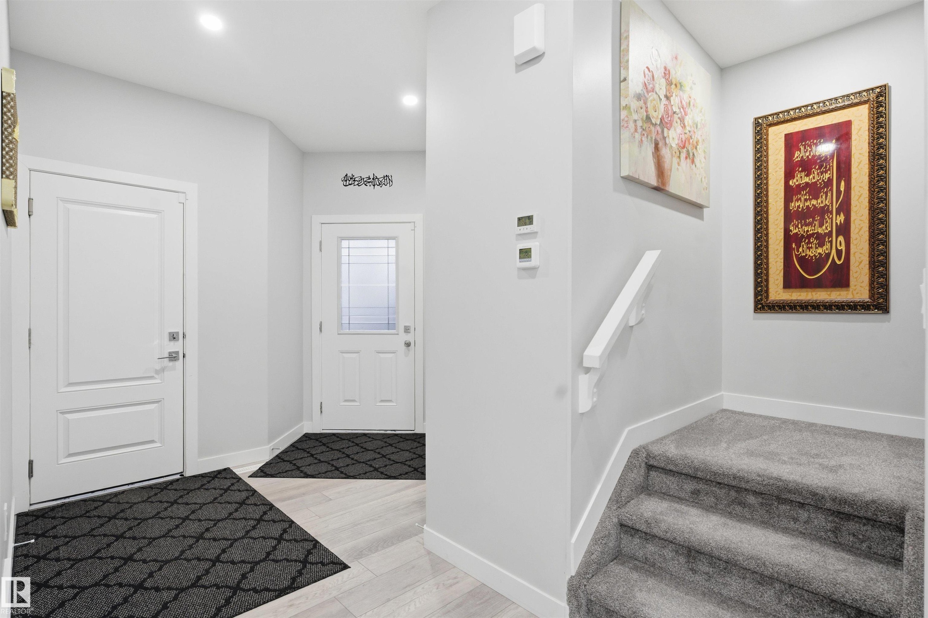 Entrance foyer with light wood-style floors, recessed lighting, and stairway - 452 Roberts Crescent, Leduc, AB - Indoor Photo Showing Other Room