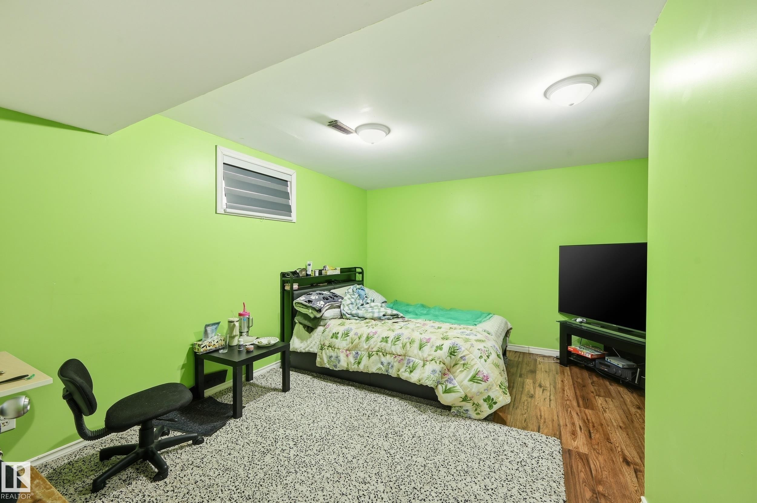 Bedroom featuring wood finished floors and baseboards - 3010 32 Avenue Nw, Edmonton, AB - Indoor Photo Showing Bedroom