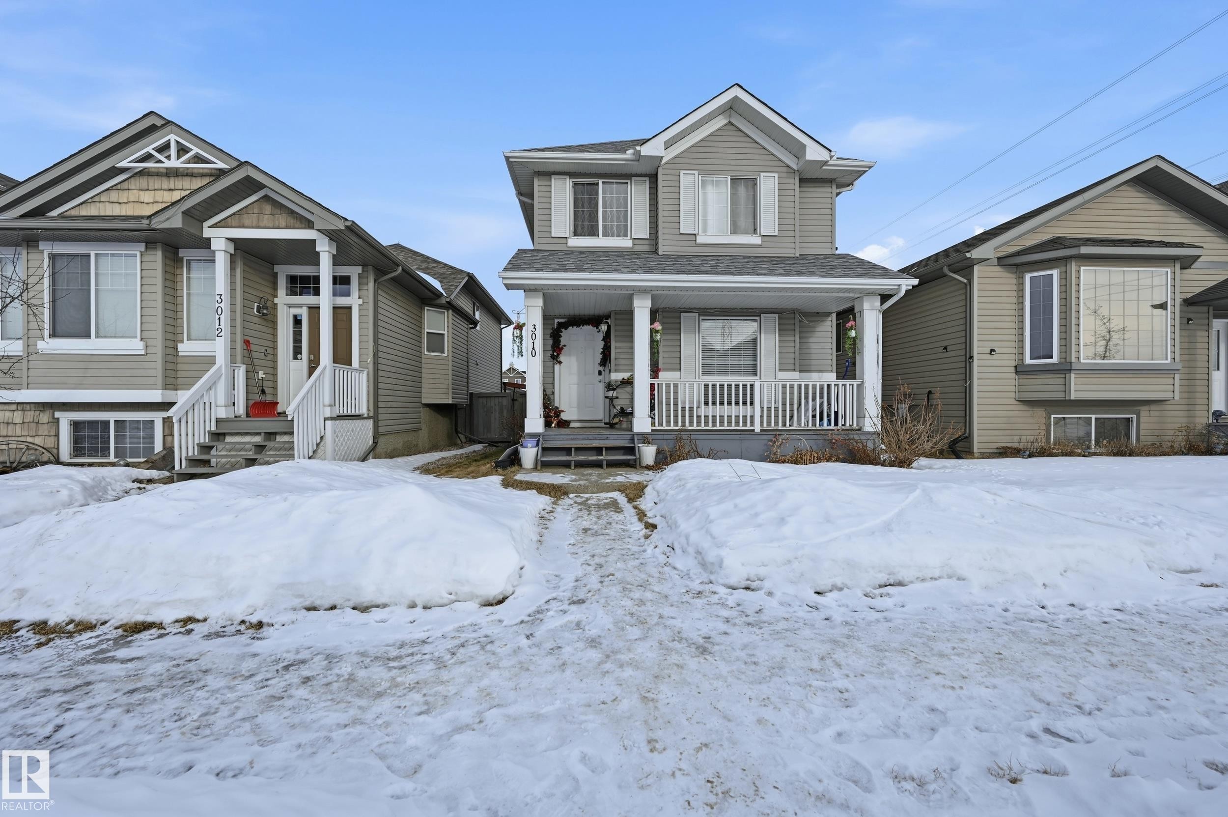 View of front of house featuring a porch and roof with shingles - 3010 32 Avenue Nw, Edmonton, AB - Outdoor With Deck Patio Veranda With Facade