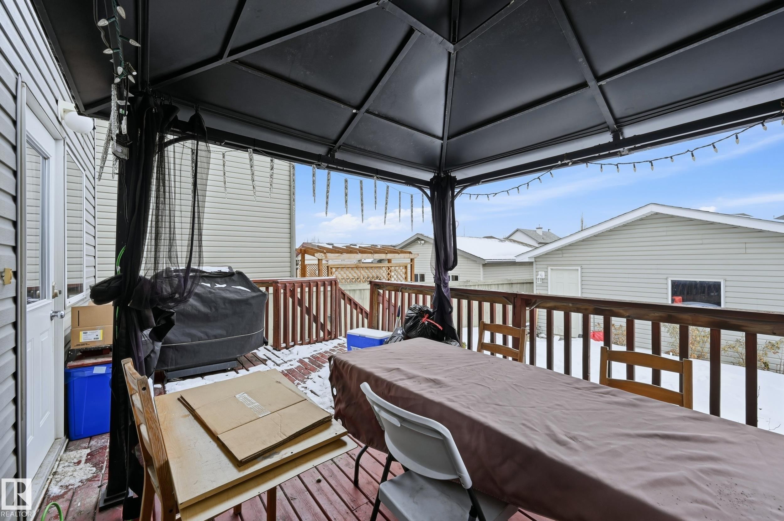 Deck featuring grilling area and outdoor dining space - 3010 32 Avenue Nw, Edmonton, AB - Outdoor With Deck Patio Veranda With Exterior