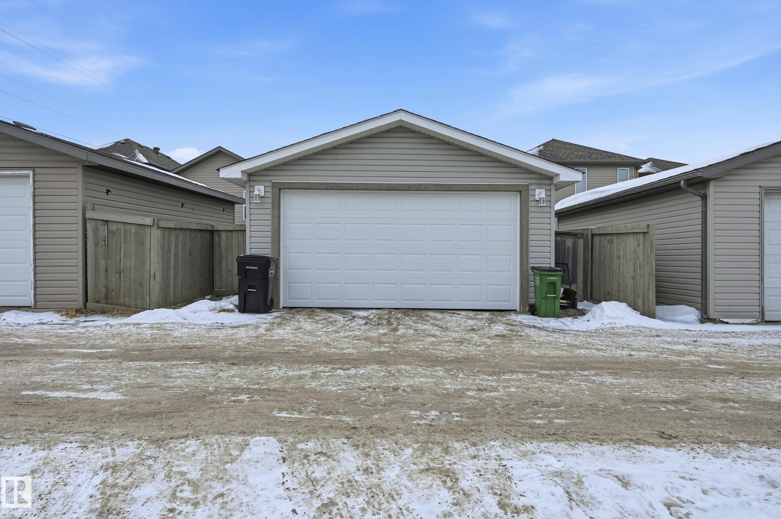 Snow covered garage with a detached garage - 3010 32 Avenue Nw, Edmonton, AB - Outdoor With Exterior