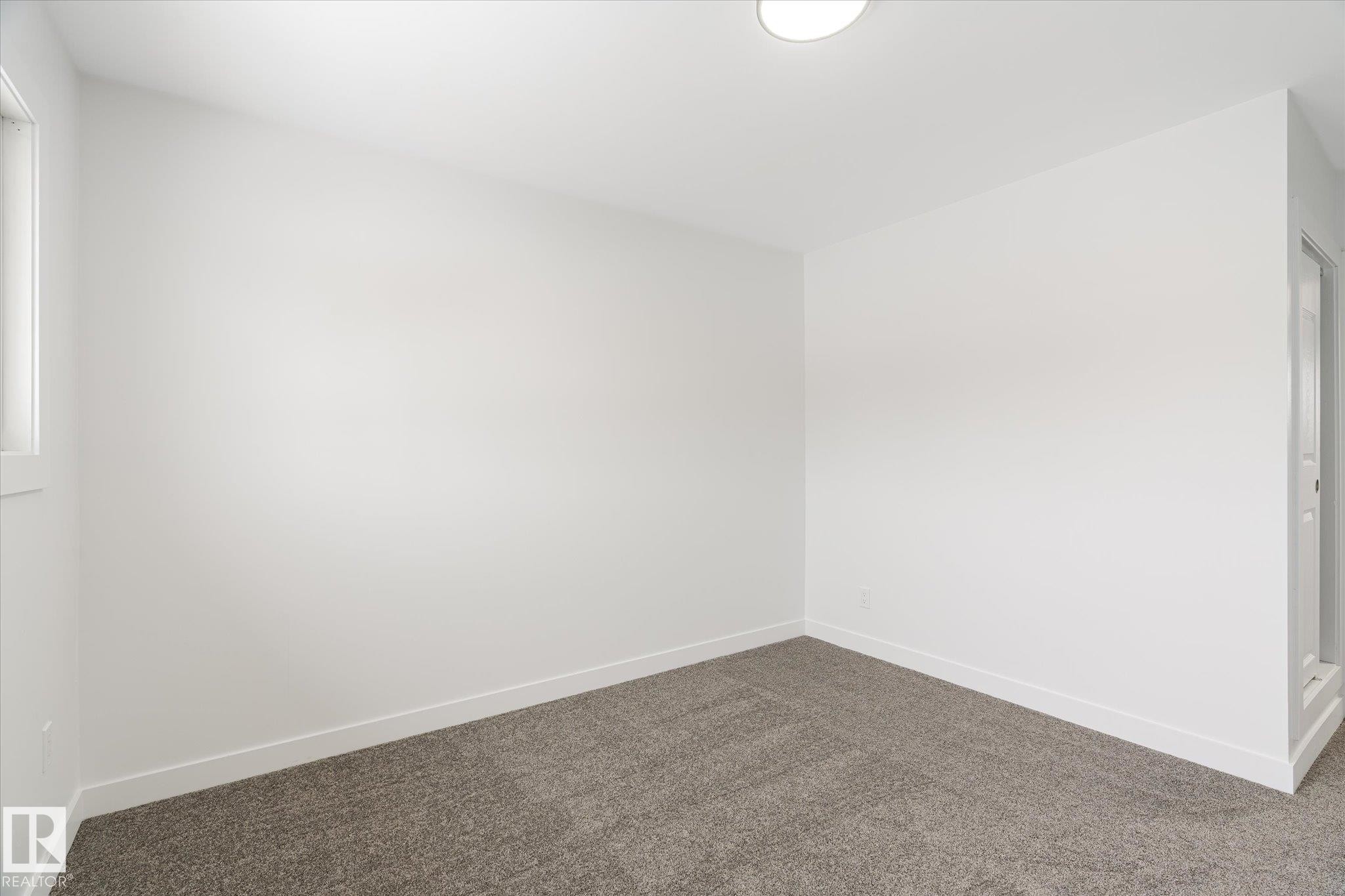 Spare room with baseboards and carpet - 5105 106A Street, Edmonton, AB - Indoor Photo Showing Other Room
