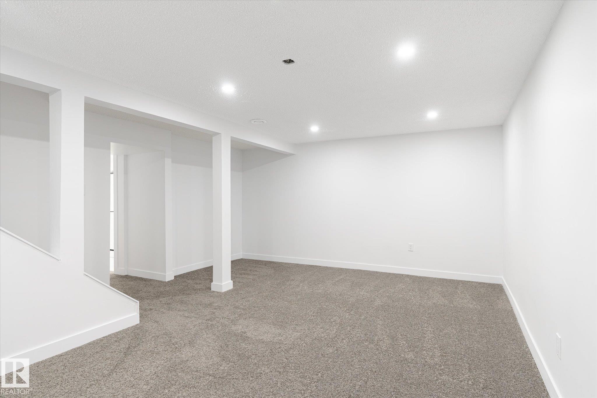 Finished basement featuring carpet flooring and recessed lighting - 5105 106A Street, Edmonton, AB - Indoor Photo Showing Other Room
