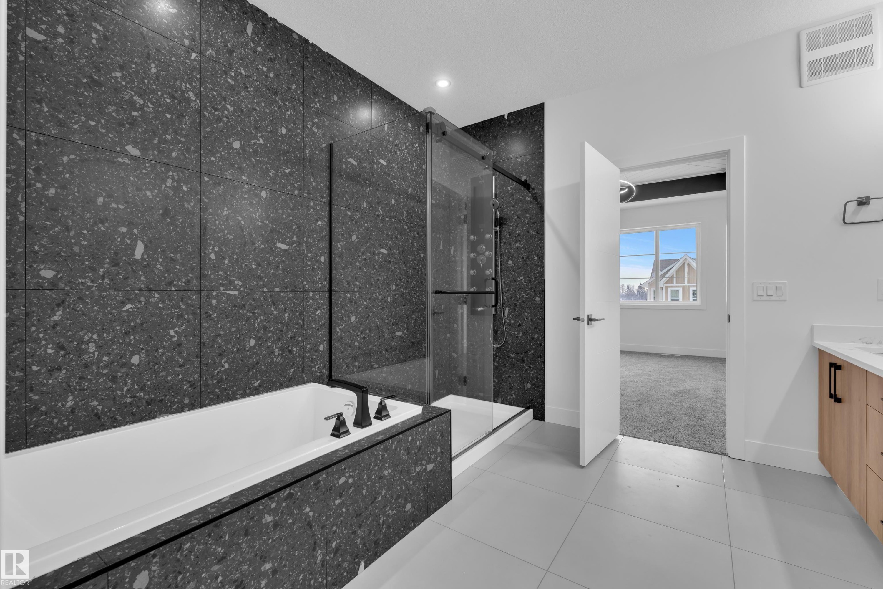 Full bathroom with a garden tub, vanity, a marble finish shower, light tile patterned floors, and light carpet - 733 Astoria Way, Devon, AB - Indoor Photo Showing Bathroom