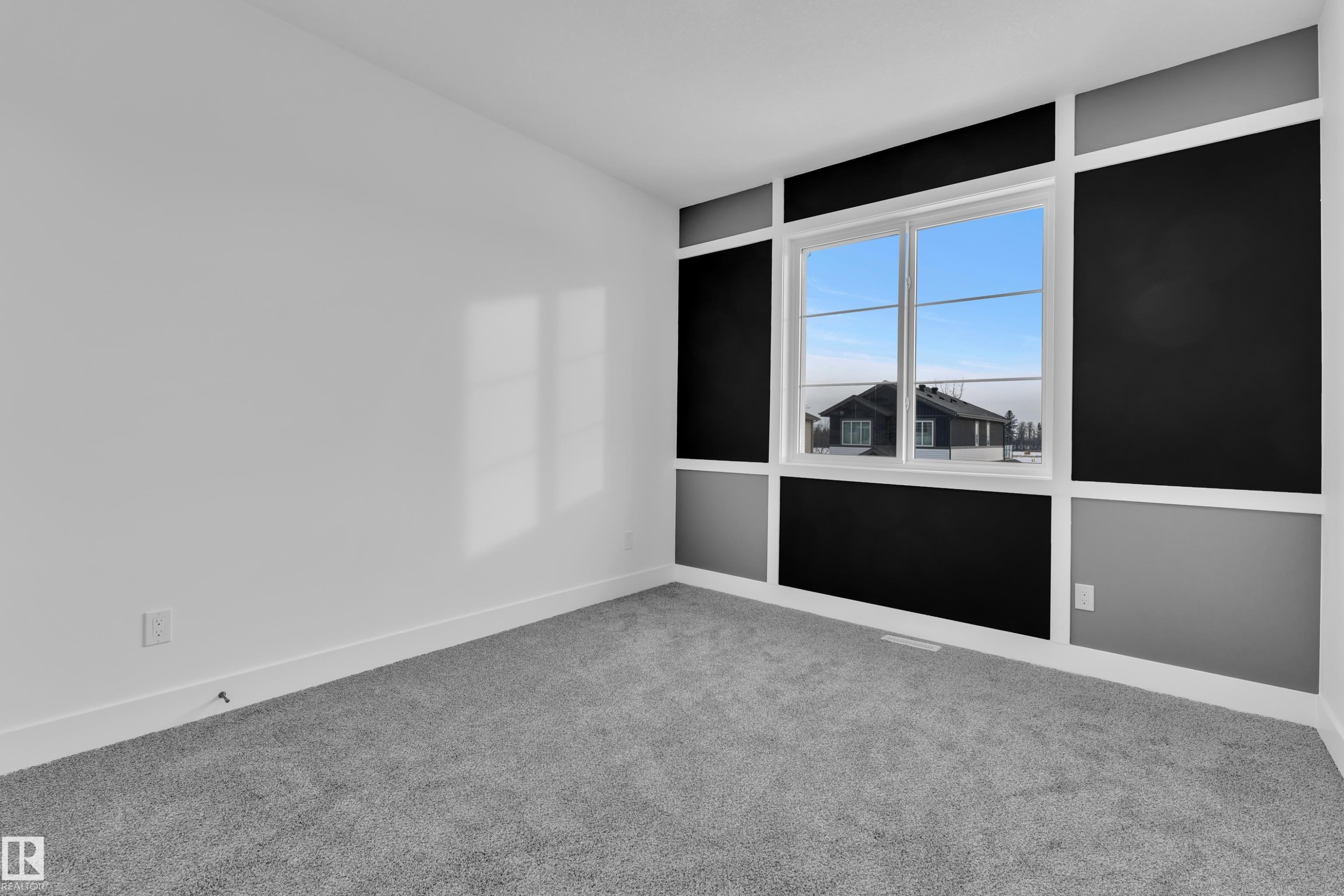 Spare room featuring light colored carpet and baseboards - 733 Astoria Way, Devon, AB - Indoor