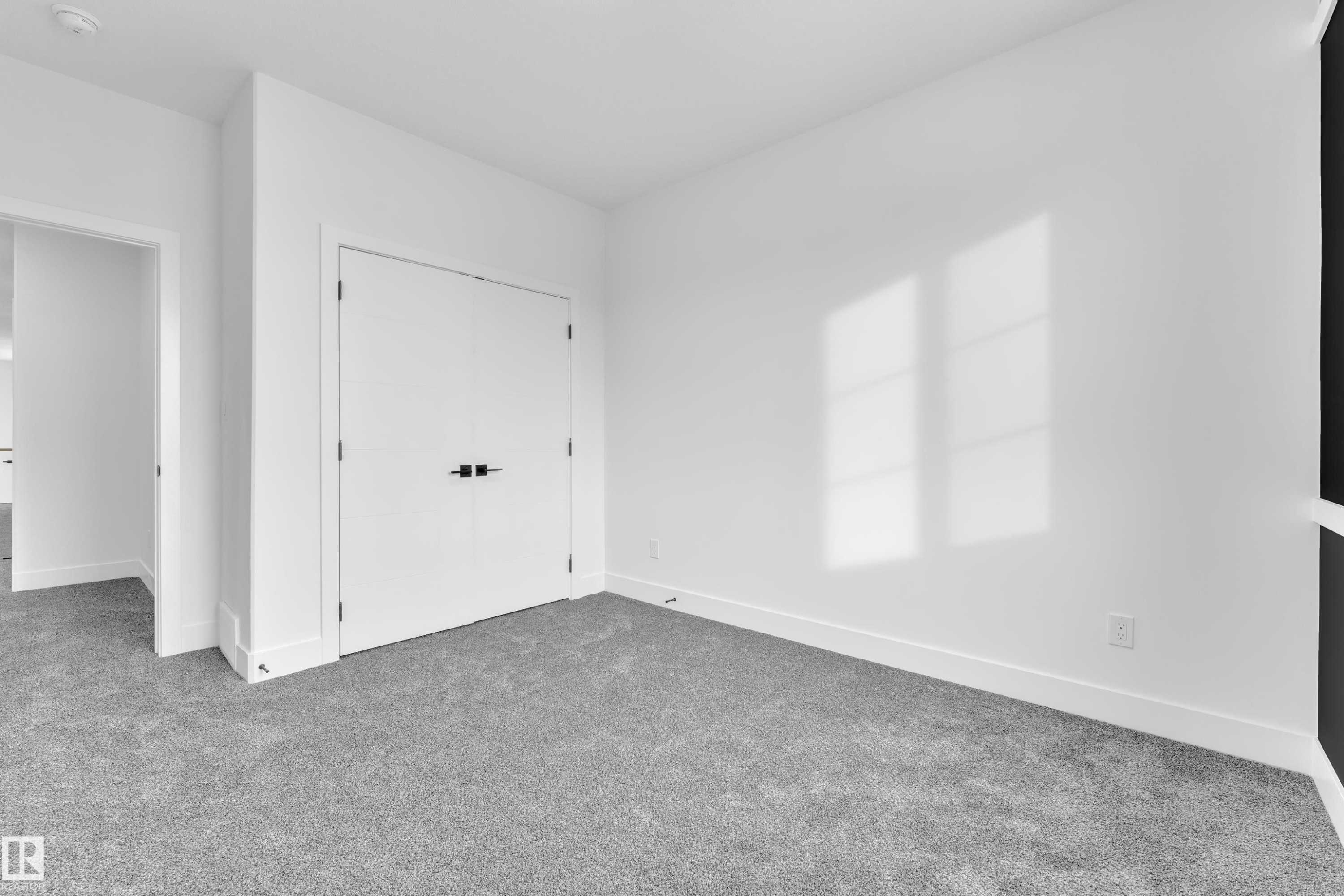 Unfurnished bedroom with carpet floors and a closet - 733 Astoria Way, Devon, AB - Indoor Photo Showing Other Room
