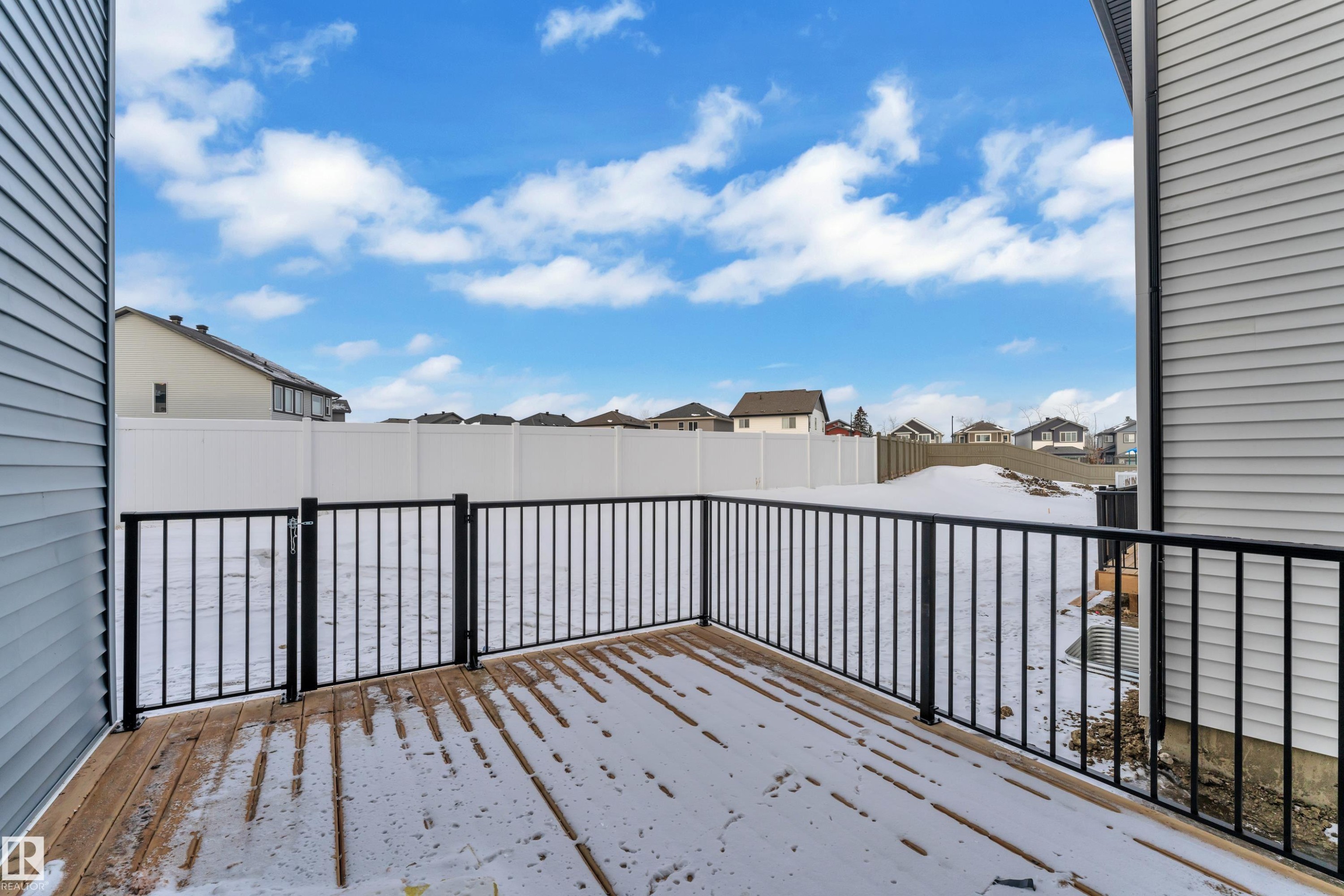 Snow covered deck with a residential view - 733 Astoria Way, Devon, AB - Outdoor