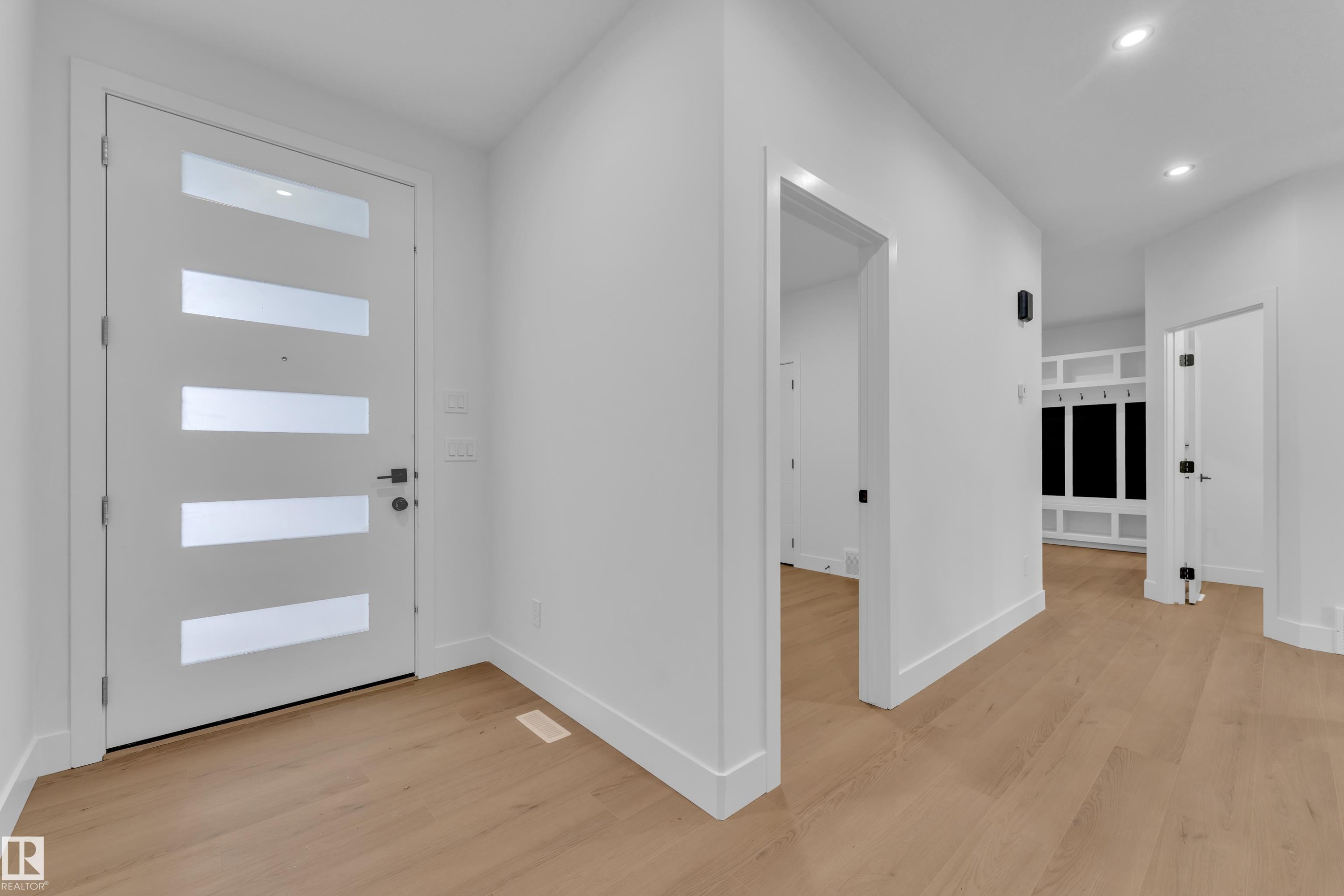 Entryway with light wood-style floors and recessed lighting - 733 Astoria Way, Devon, AB - Indoor Photo Showing Other Room
